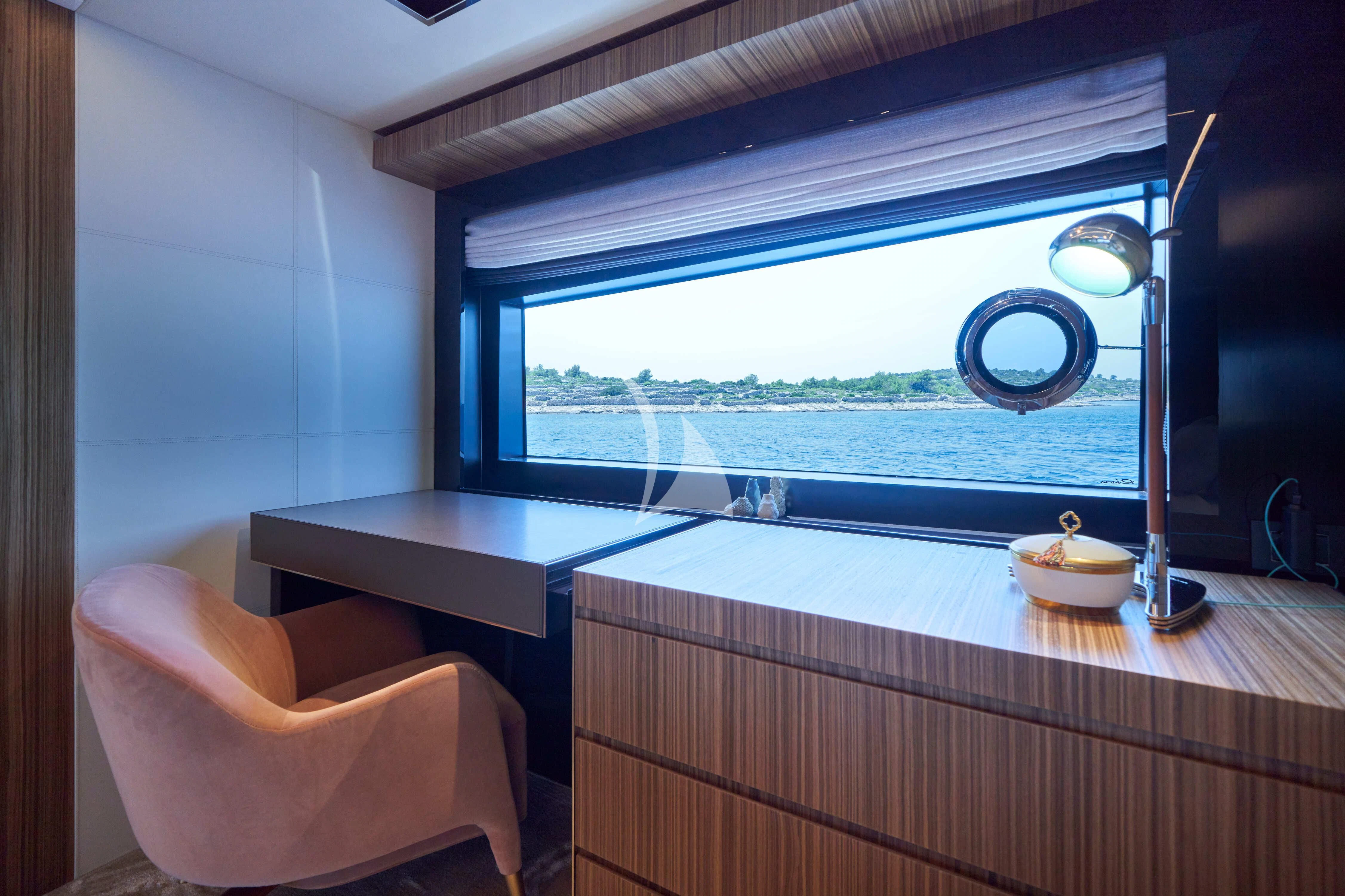 a room with a table and chairs aboard NIKITA Yacht for Sale