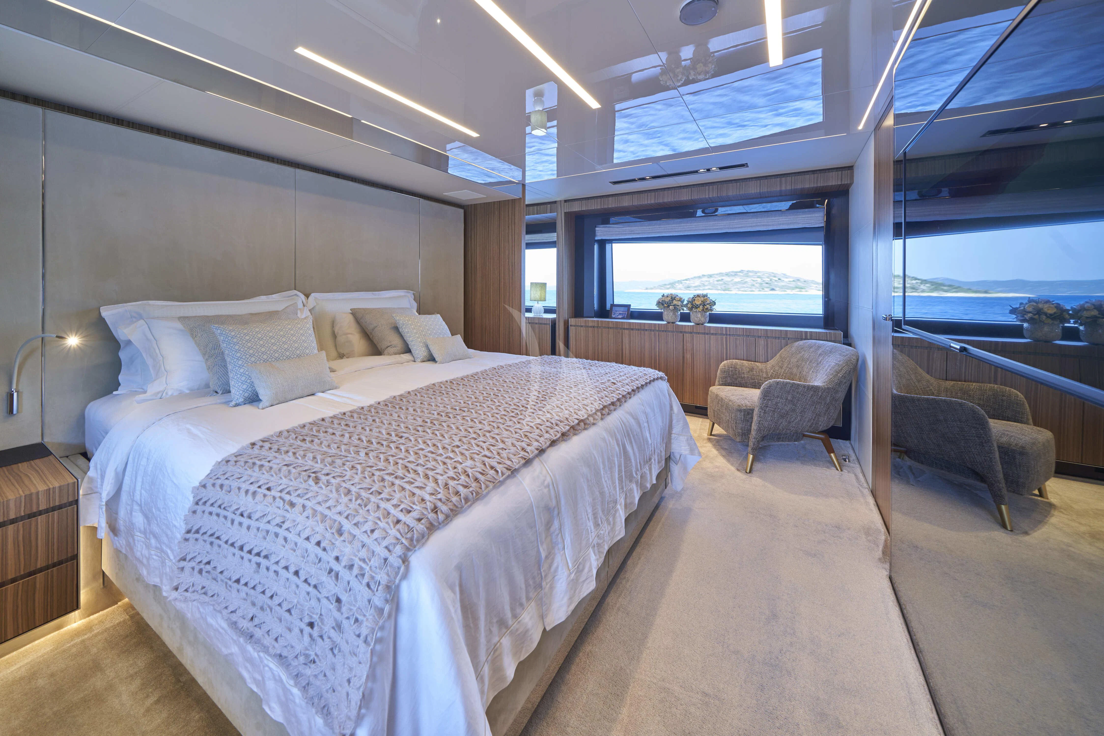 a large bed in a room aboard NIKITA Yacht for Sale