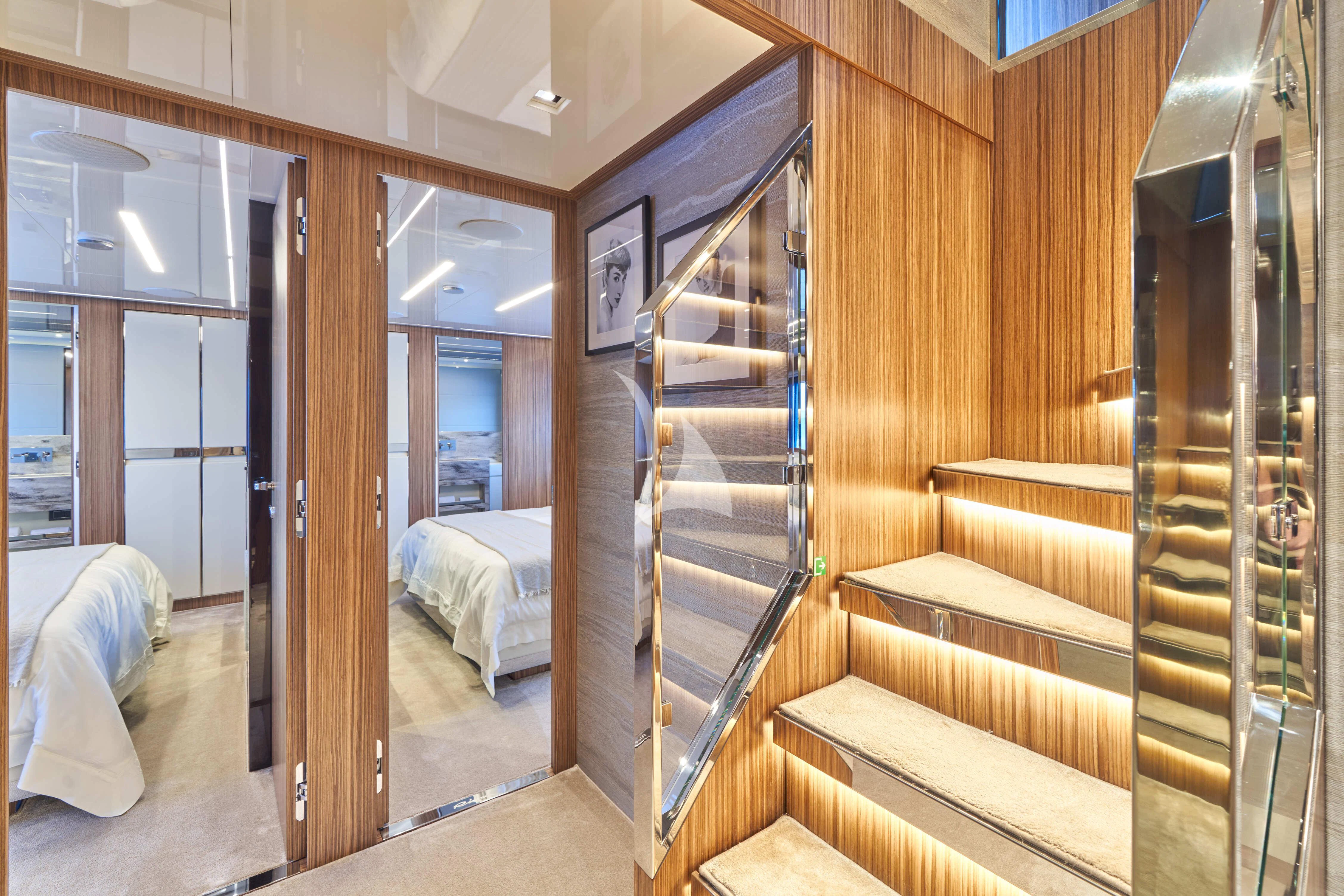 a room with wooden walls and a bed aboard NIKITA Yacht for Sale