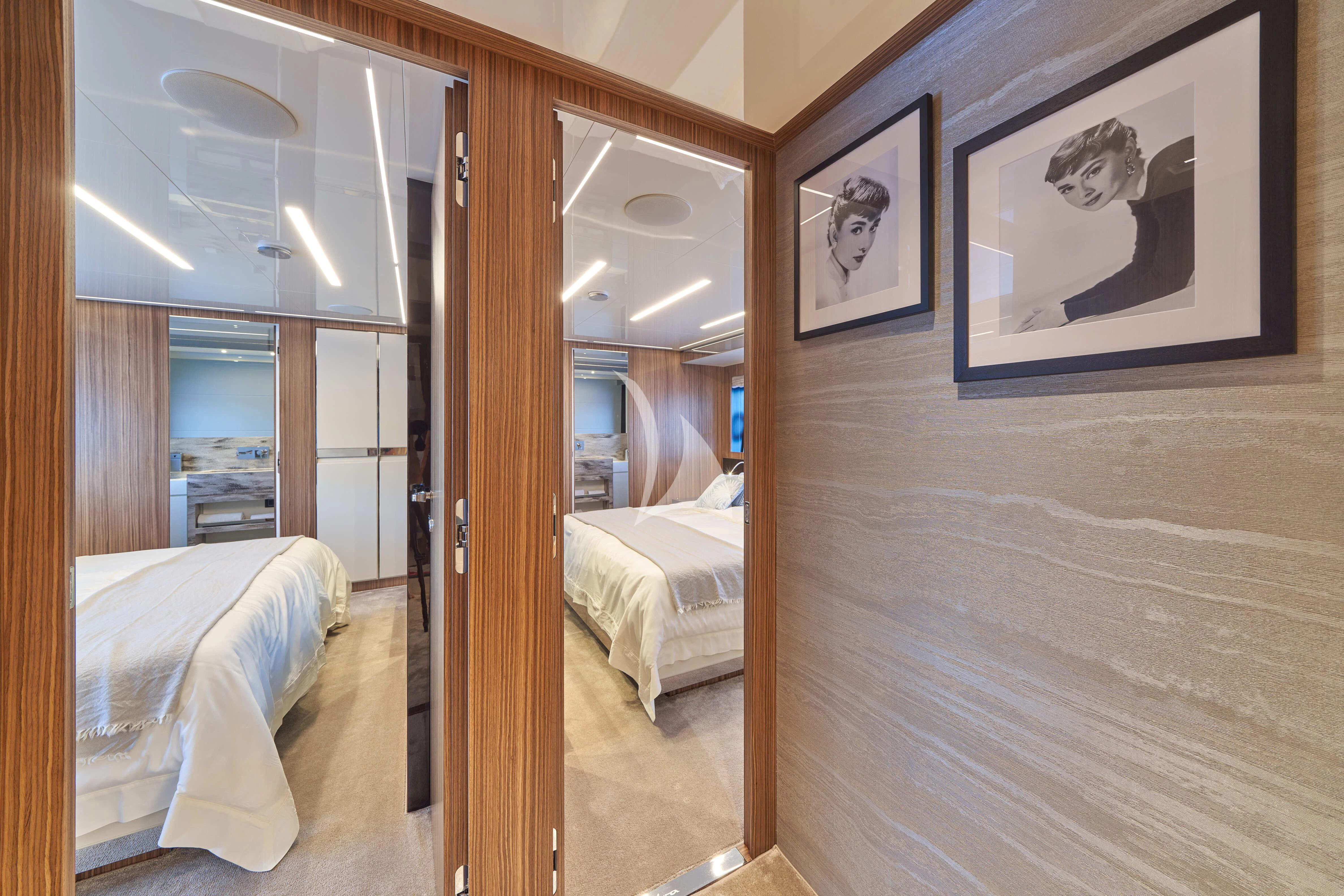 a room with a mirror and a bed aboard NIKITA Yacht for Sale
