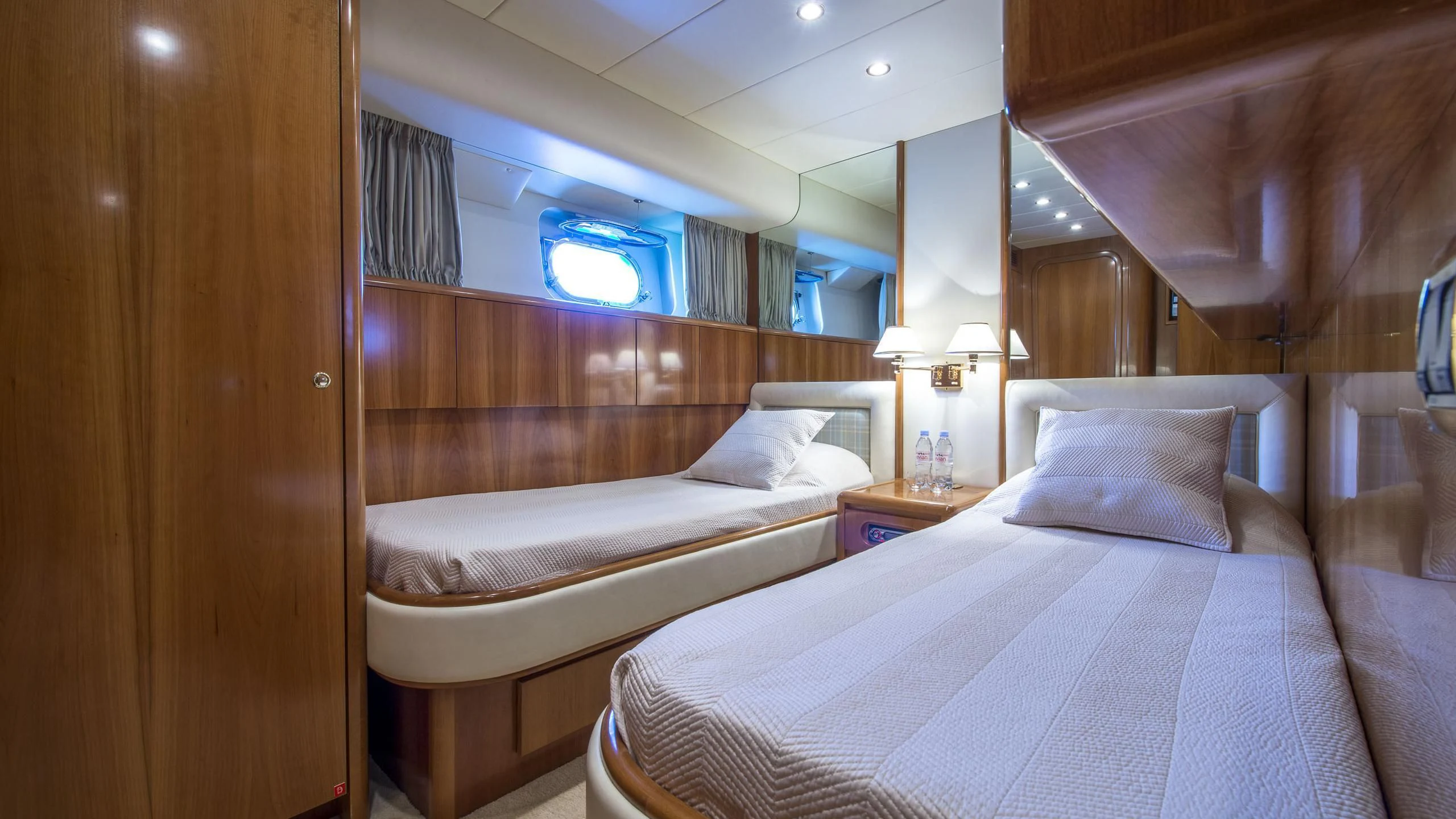 a room with two beds aboard ACE1 Yacht for Sale