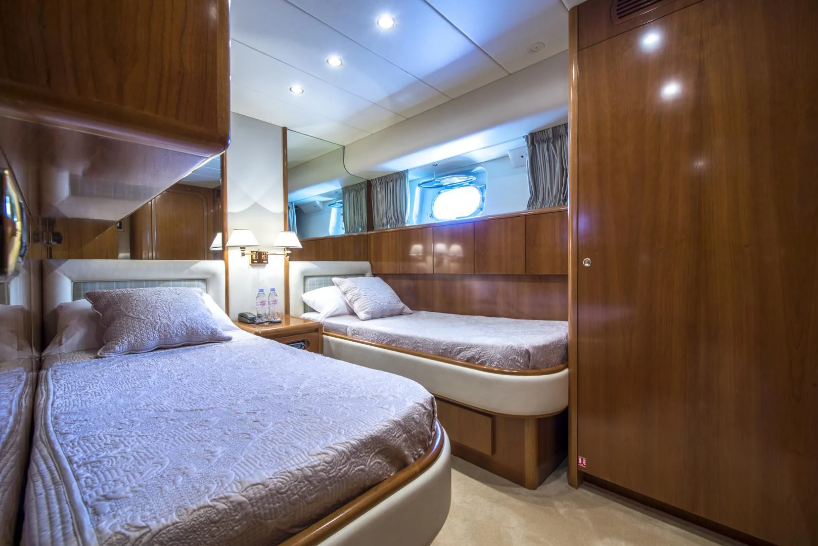 a room with two beds aboard ACE1 Yacht for Sale