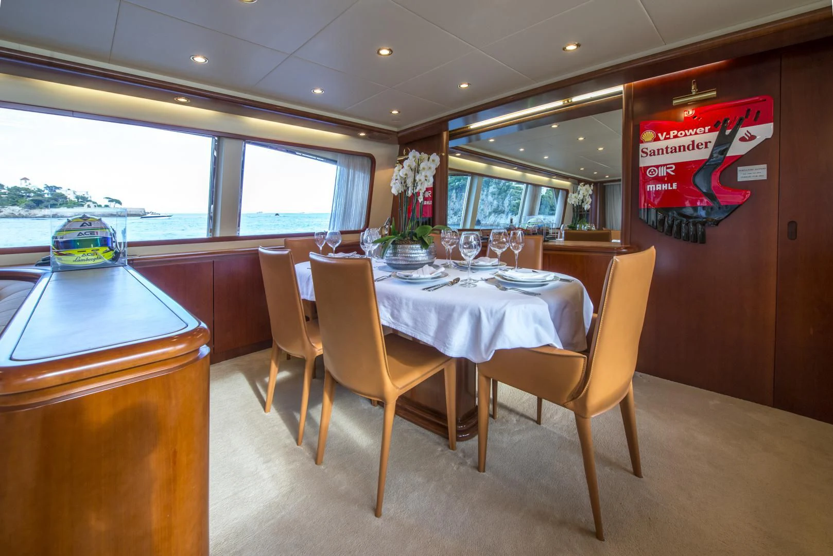a table and chairs in a restaurant aboard ACE1 Yacht for Sale