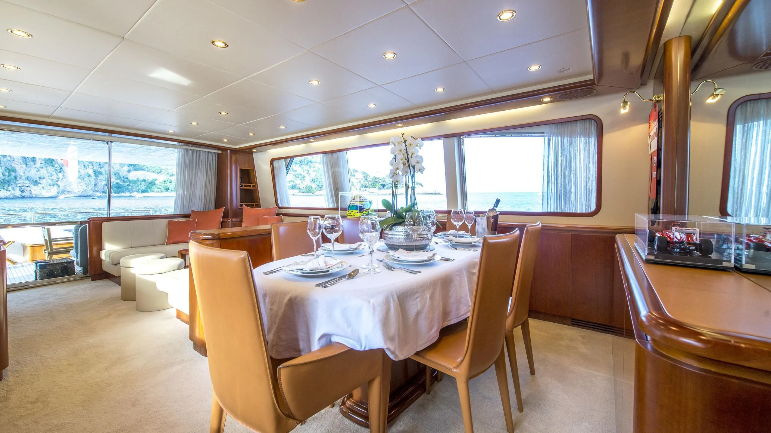 a dining room with a table and chairs aboard ACE1 Yacht for Sale