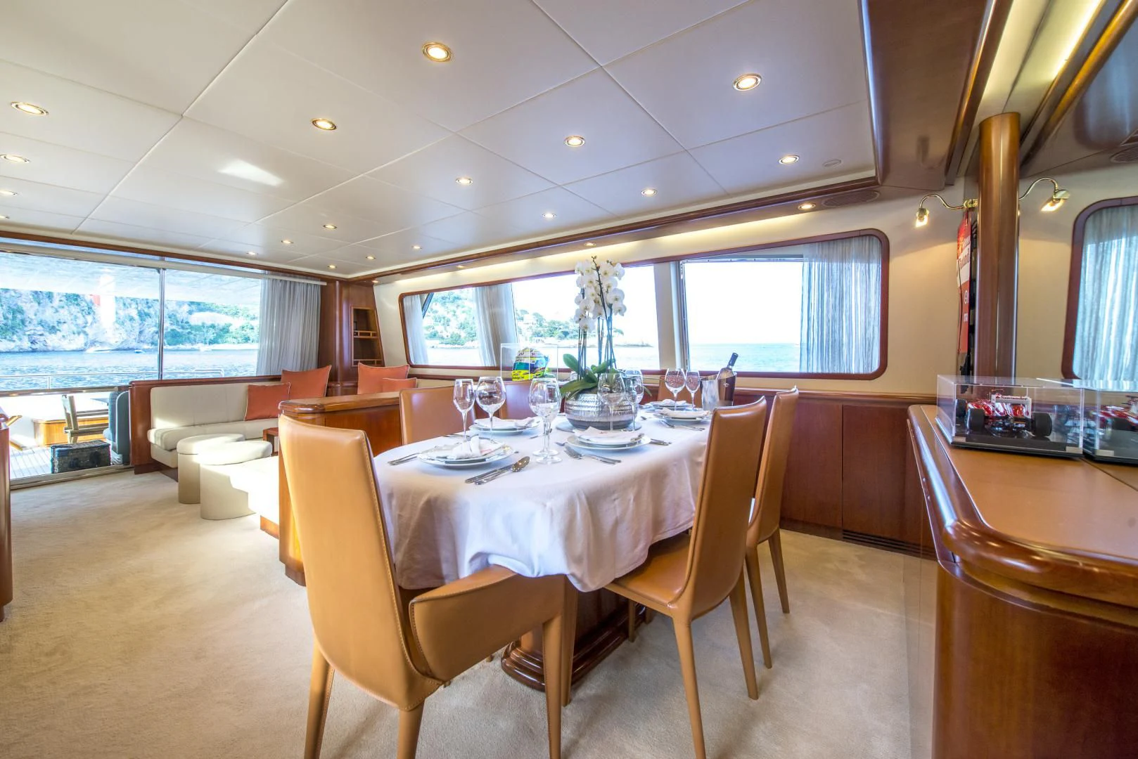 a dining room with a table and chairs aboard ACE1 Yacht for Sale
