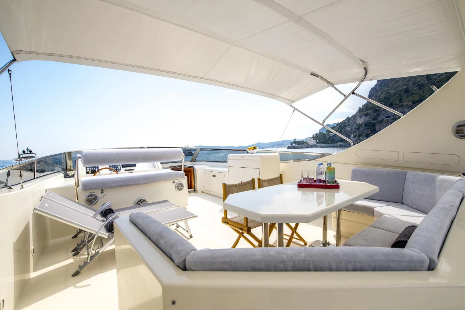 a room with a bed and a table aboard ACE1 Yacht for Sale