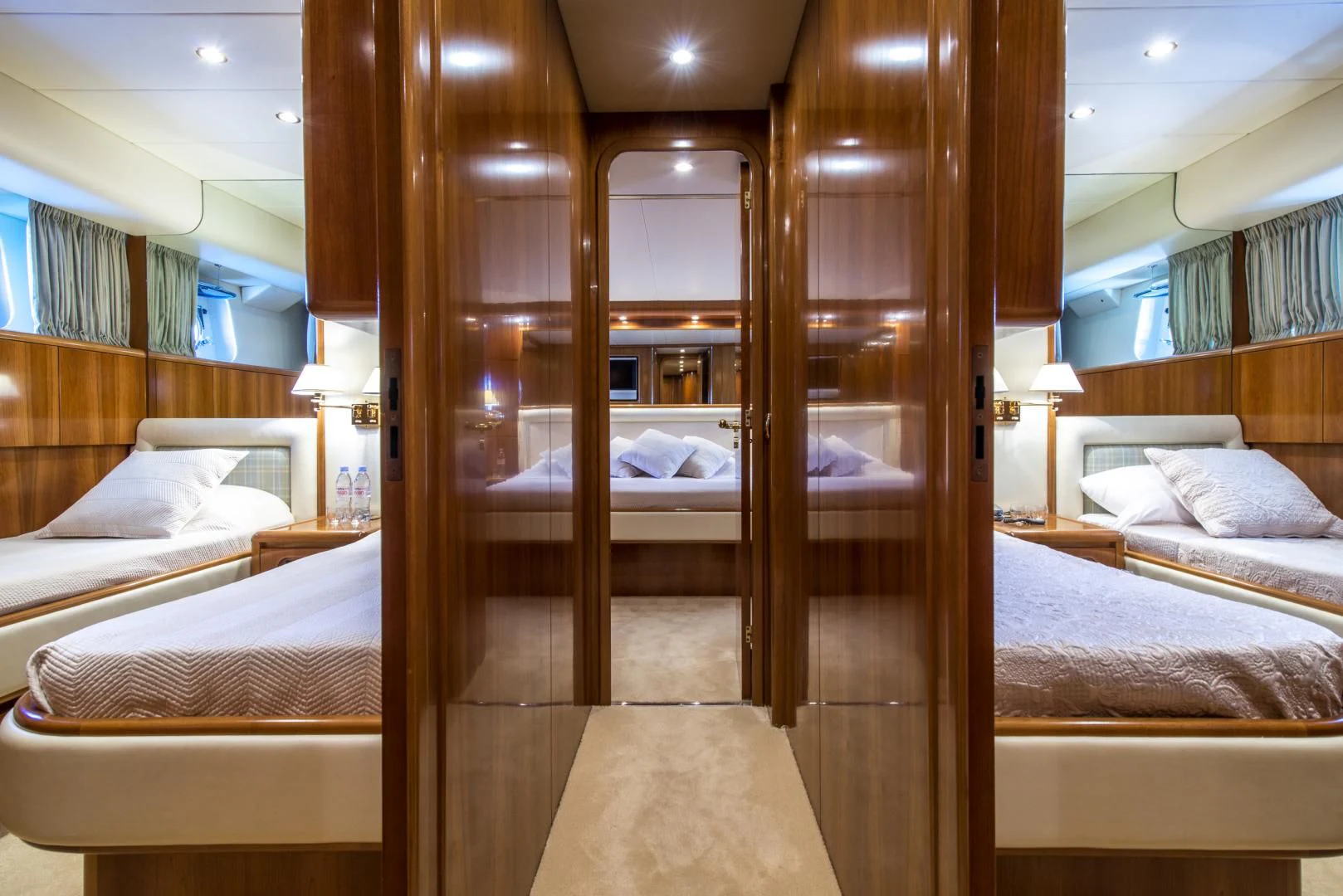 a room with a bed and a mirror aboard ACE1 Yacht for Sale