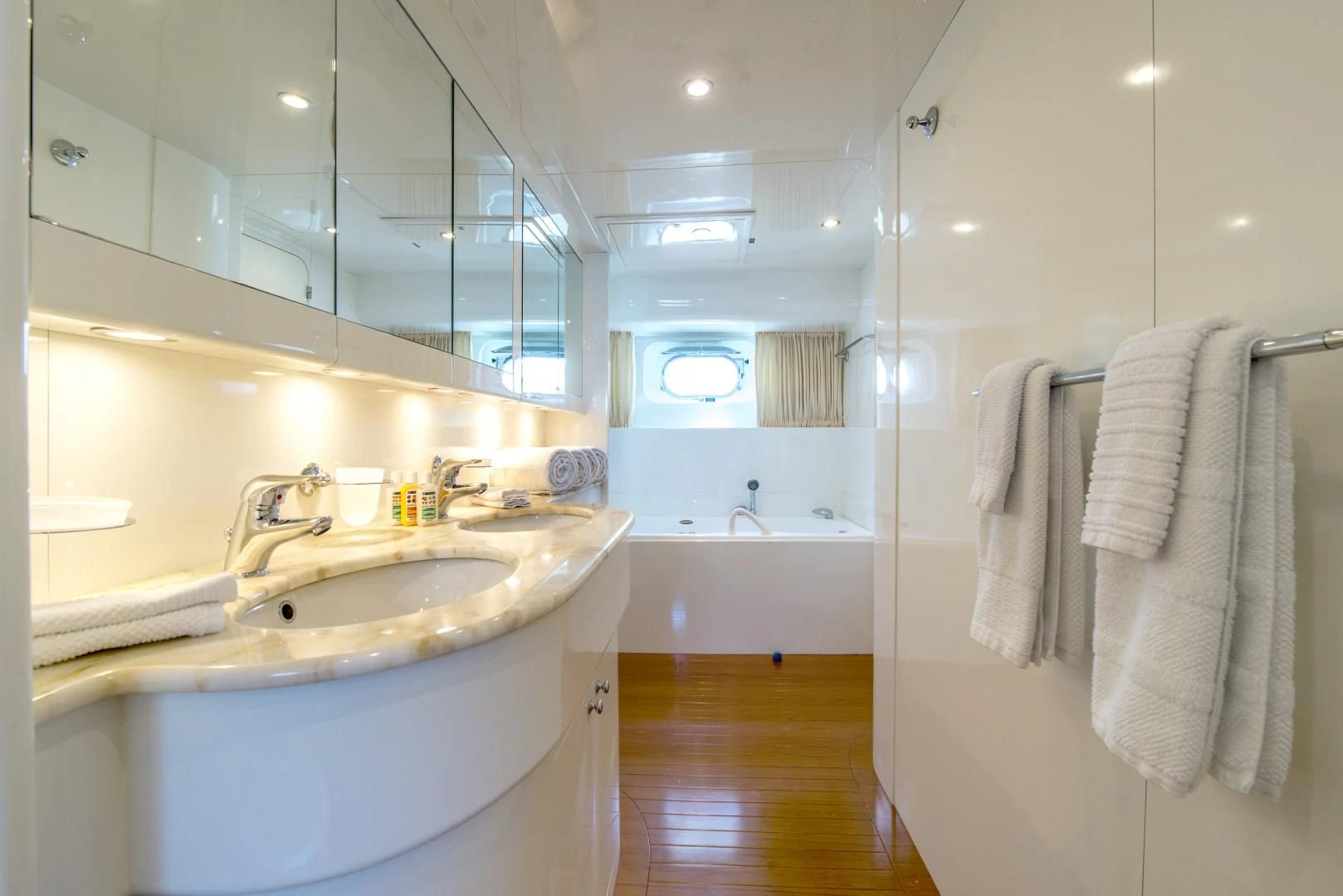 a bathroom with a sink and a bathtub aboard ACE1 Yacht for Sale