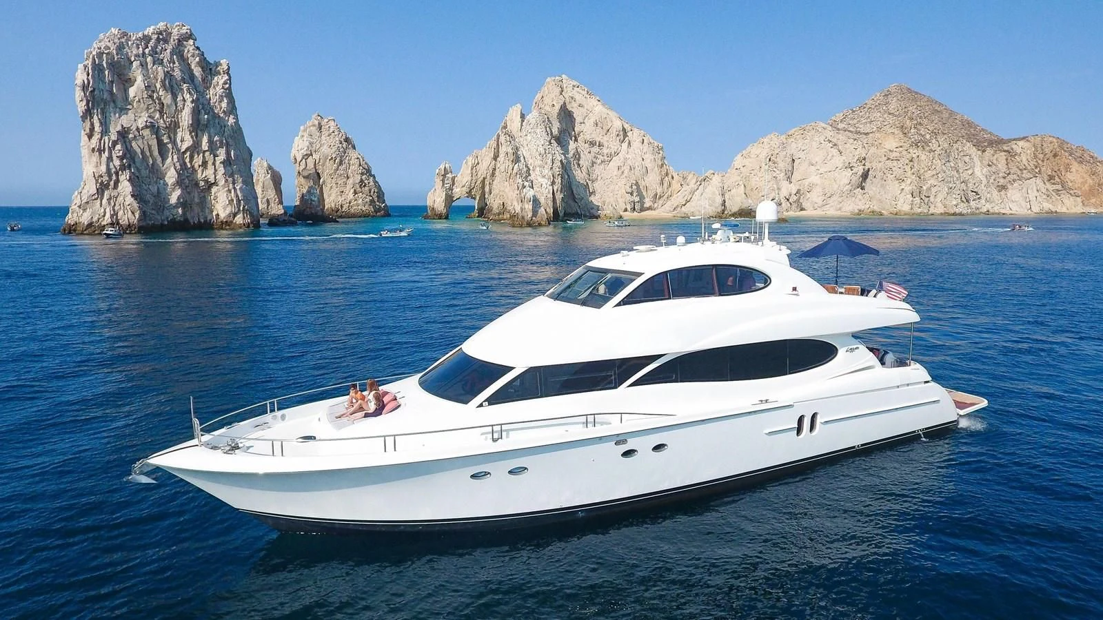 a white yacht in the water aboard LAZZARA 80' Yacht for Sale