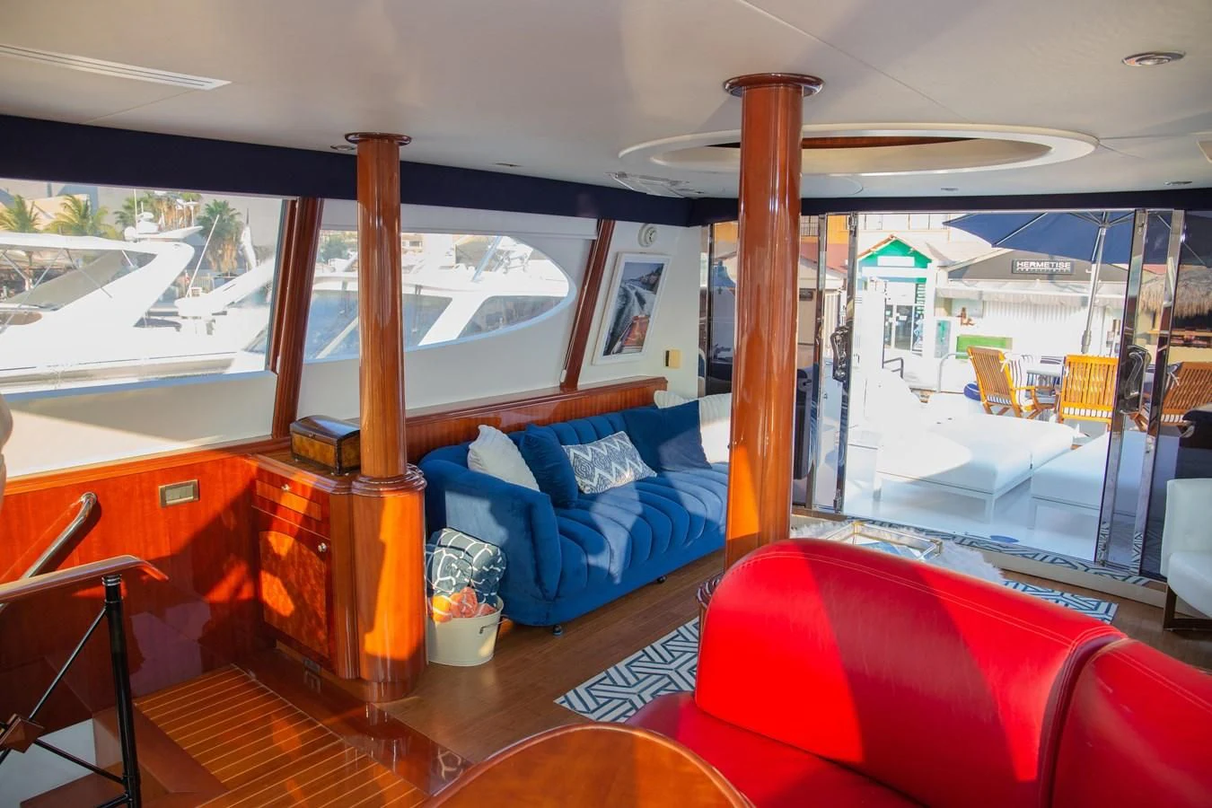 a room with a view of the ocean and the deck aboard LAZZARA 80' Yacht for Sale