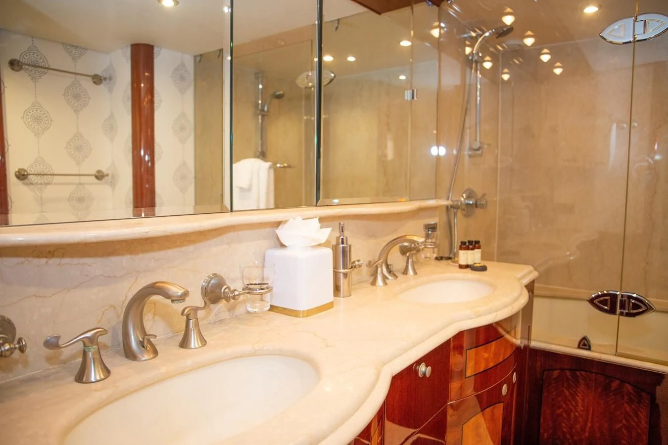 a bathroom with red cabinets aboard LAZZARA 80' Yacht for Sale