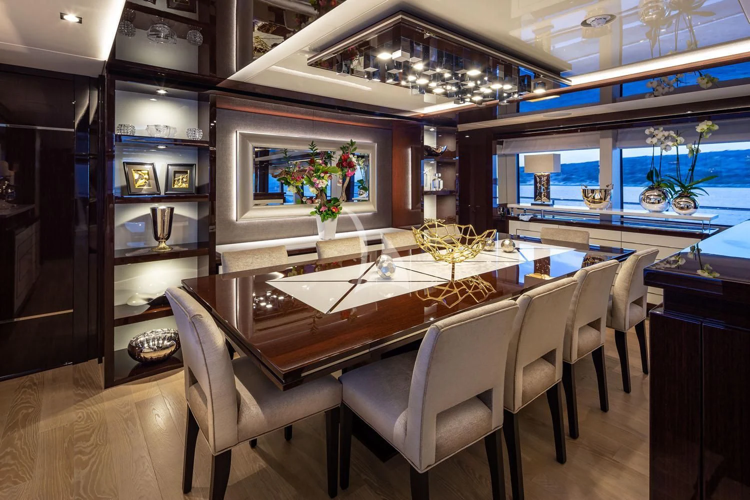 a large dining table in a room aboard AQUA LIBRA Yacht for Charter
