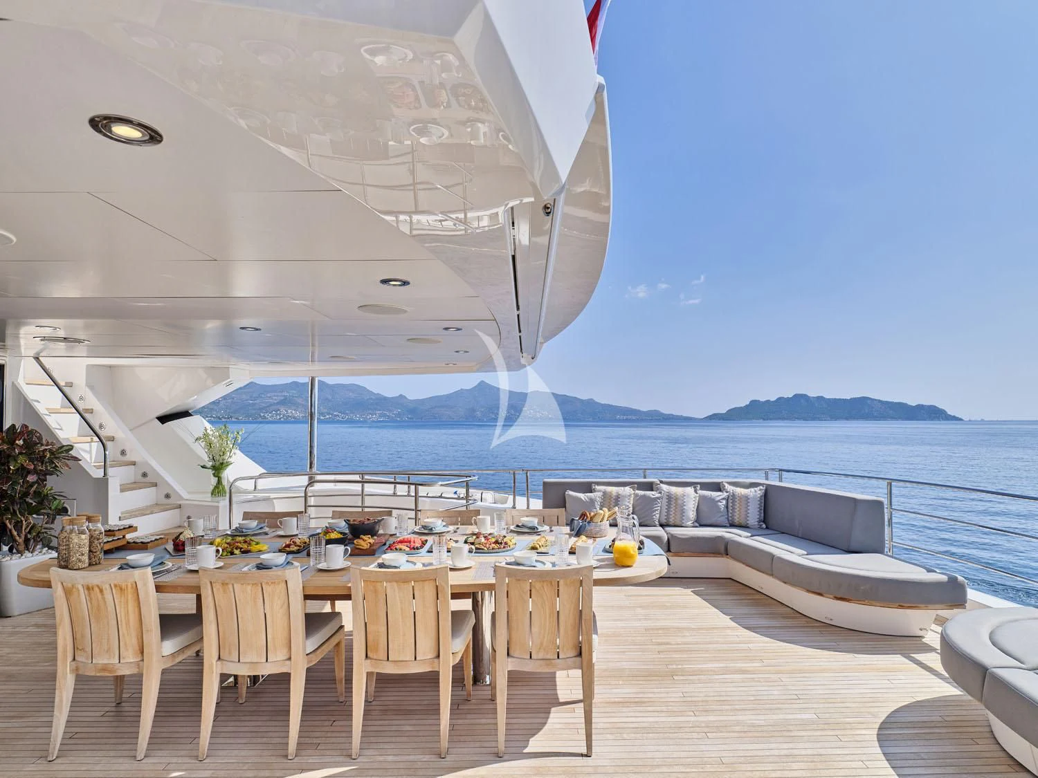 a room with a table and chairs aboard AQUA LIBRA Yacht for Charter