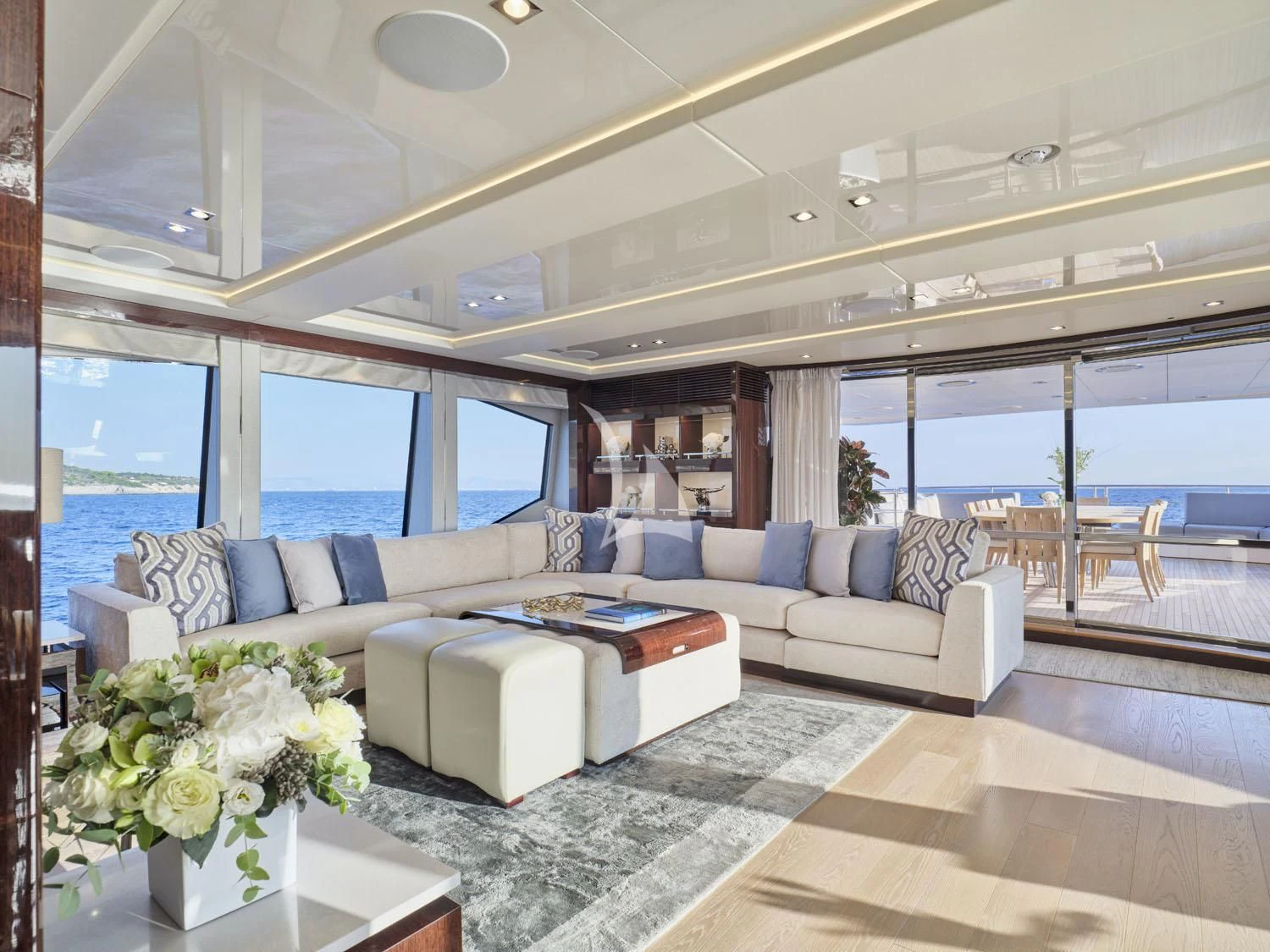 a living room with a large window aboard AQUA LIBRA Yacht for Charter