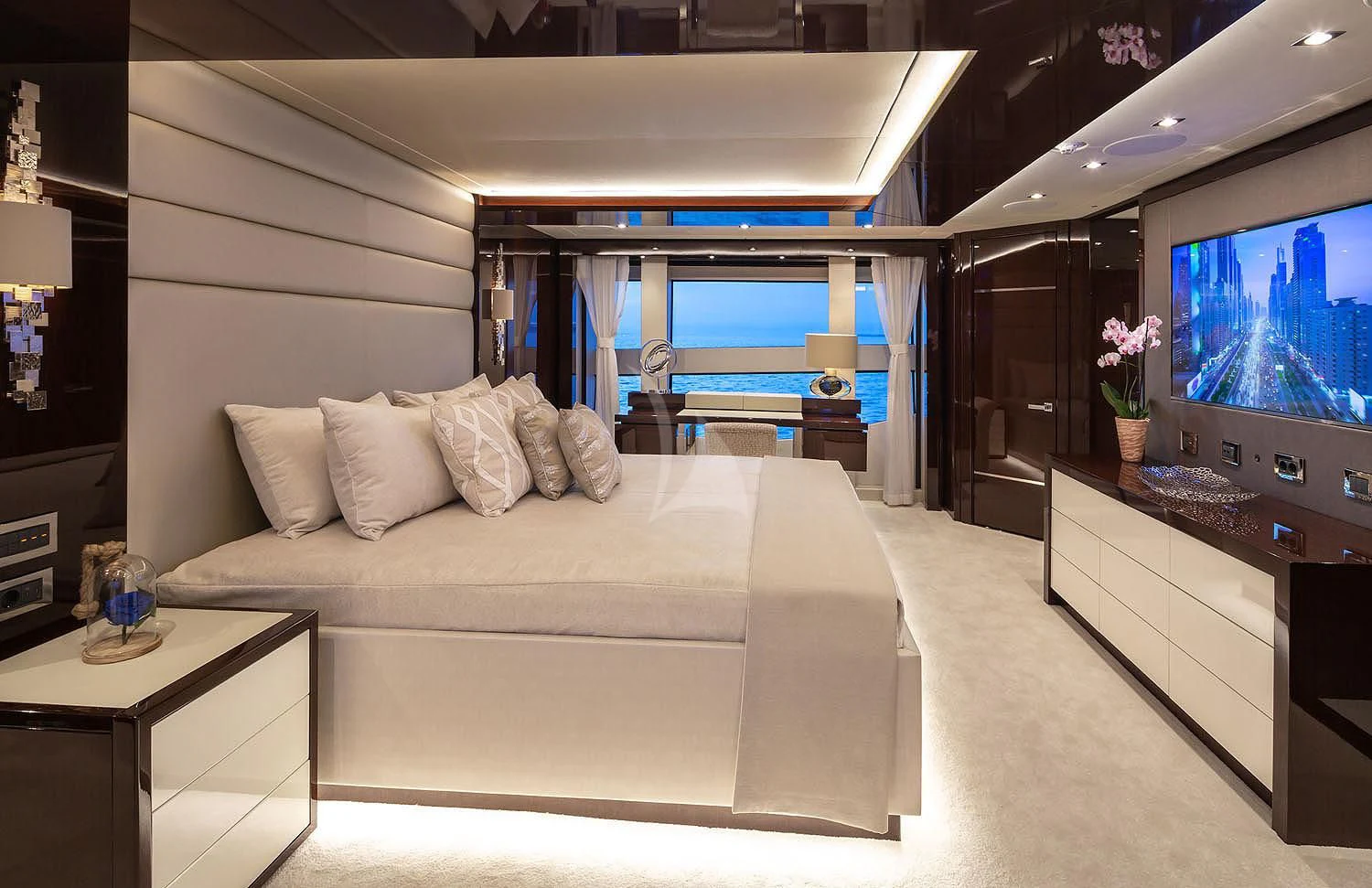 a living room with a large television aboard AQUA LIBRA Yacht for Charter