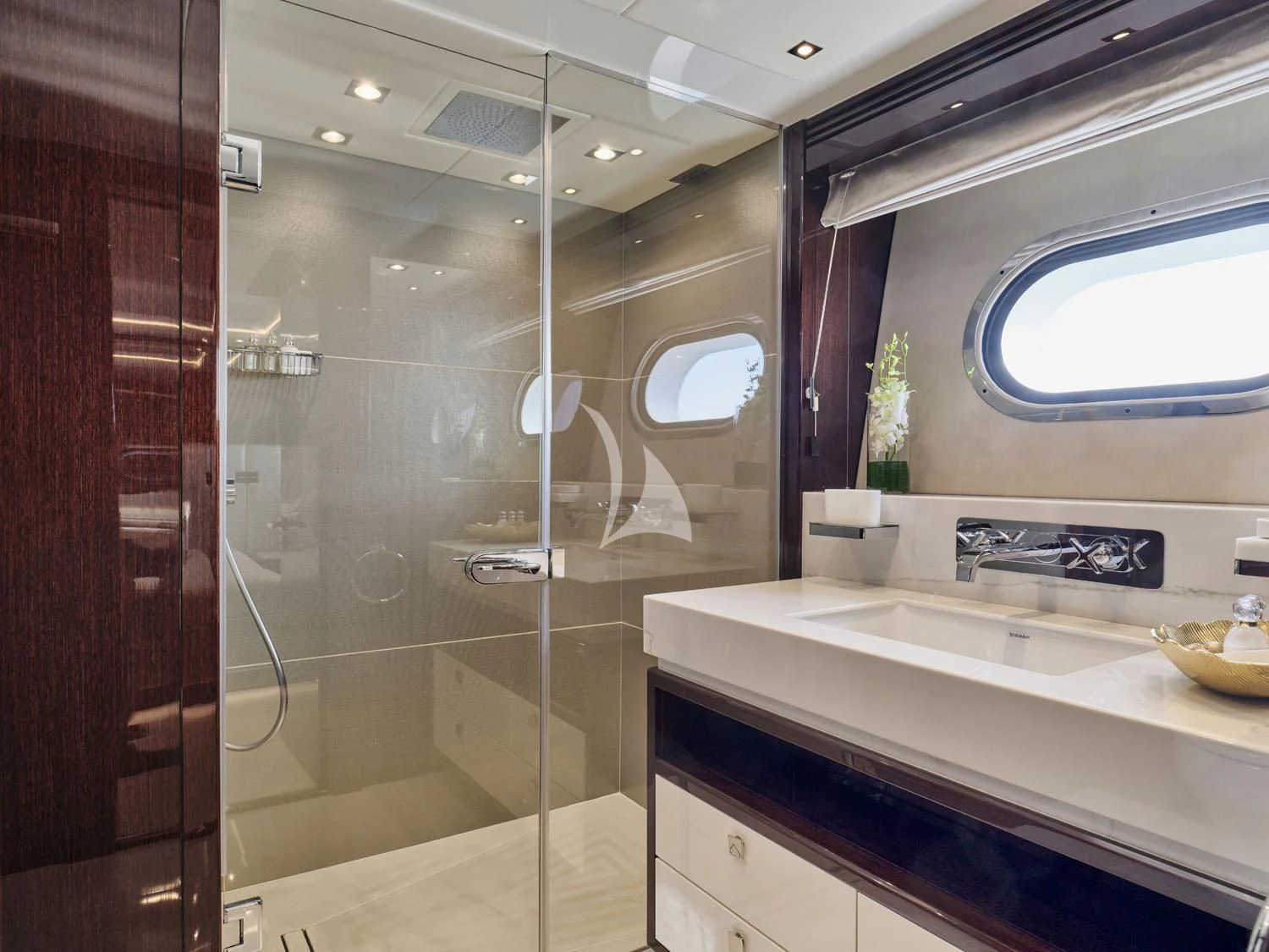 a bathroom with a glass shower aboard AQUA LIBRA Yacht for Charter