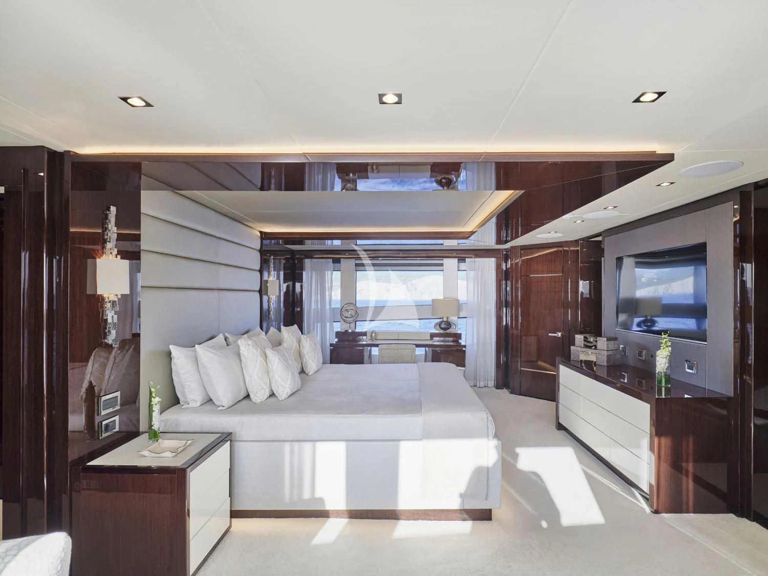 a bedroom with a large bed aboard AQUA LIBRA Yacht for Charter