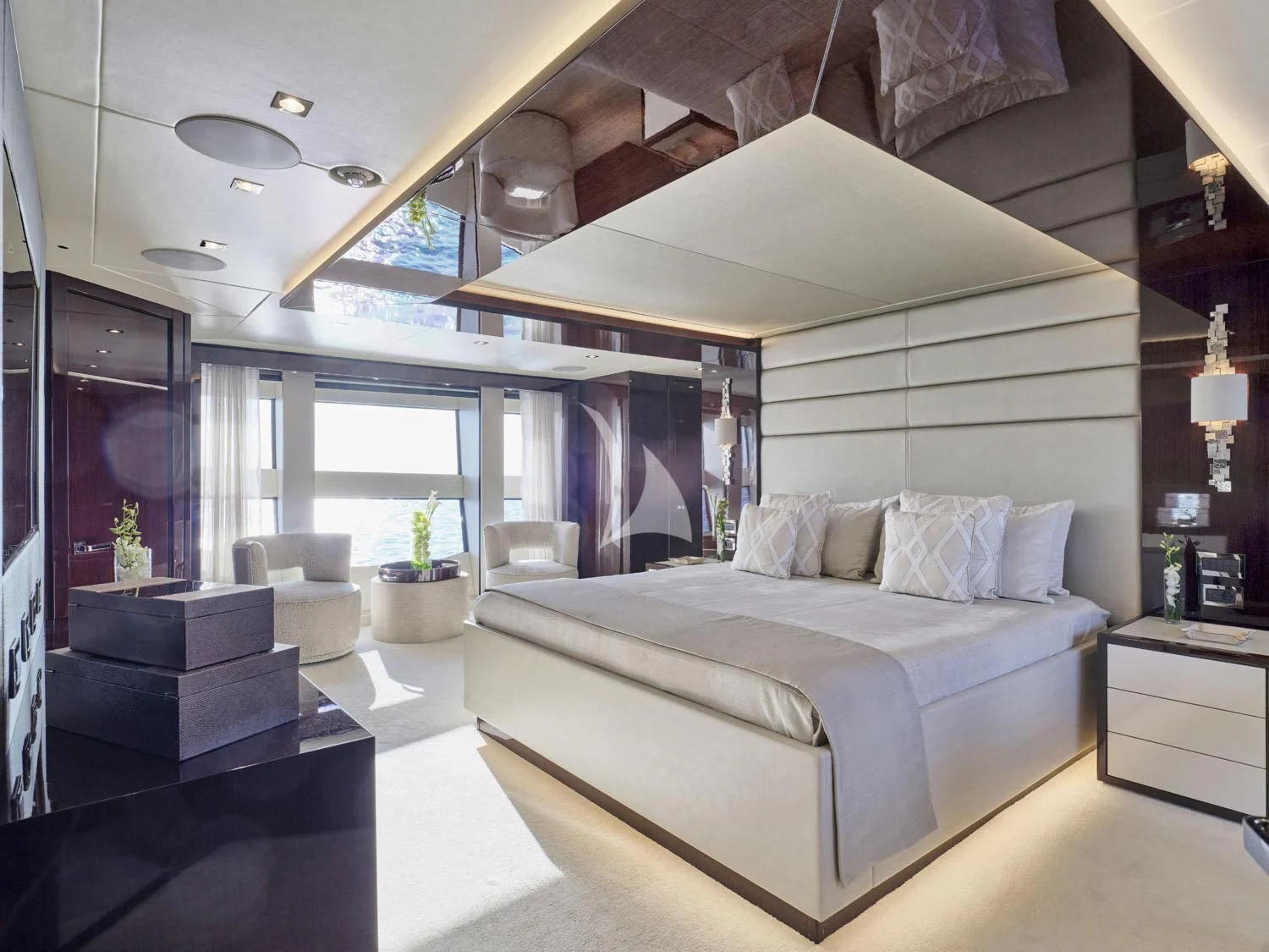 a large white bed in a room aboard AQUA LIBRA Yacht for Charter