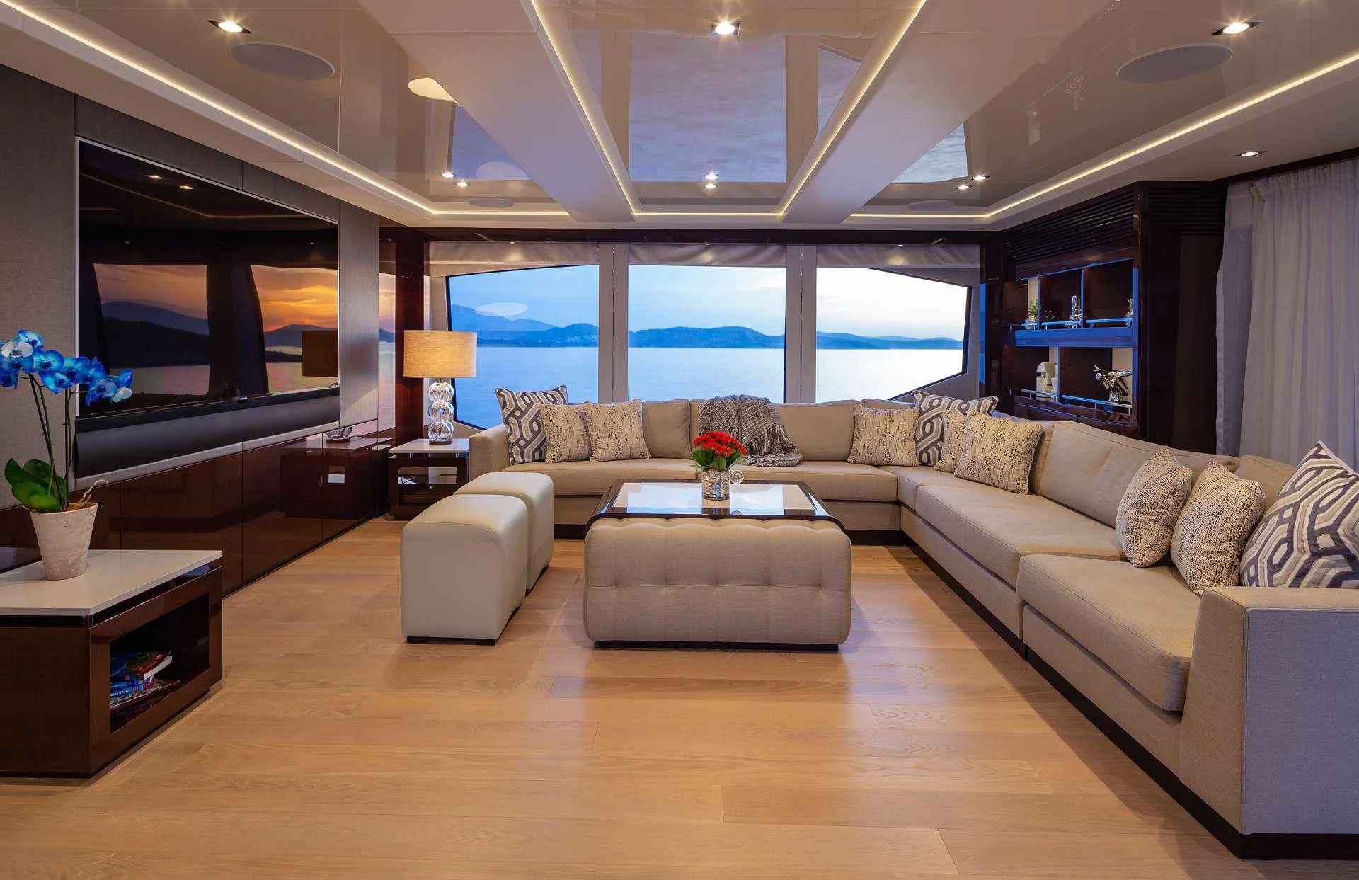 a living room with a large window aboard AQUA LIBRA Yacht for Charter