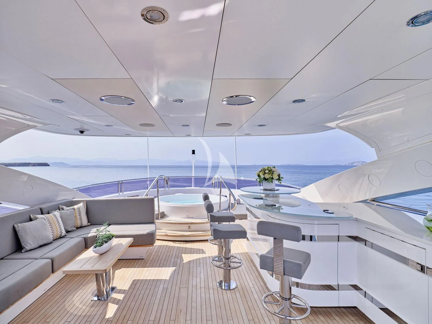 a room with a couch and a table and a table aboard AQUA LIBRA Yacht for Charter