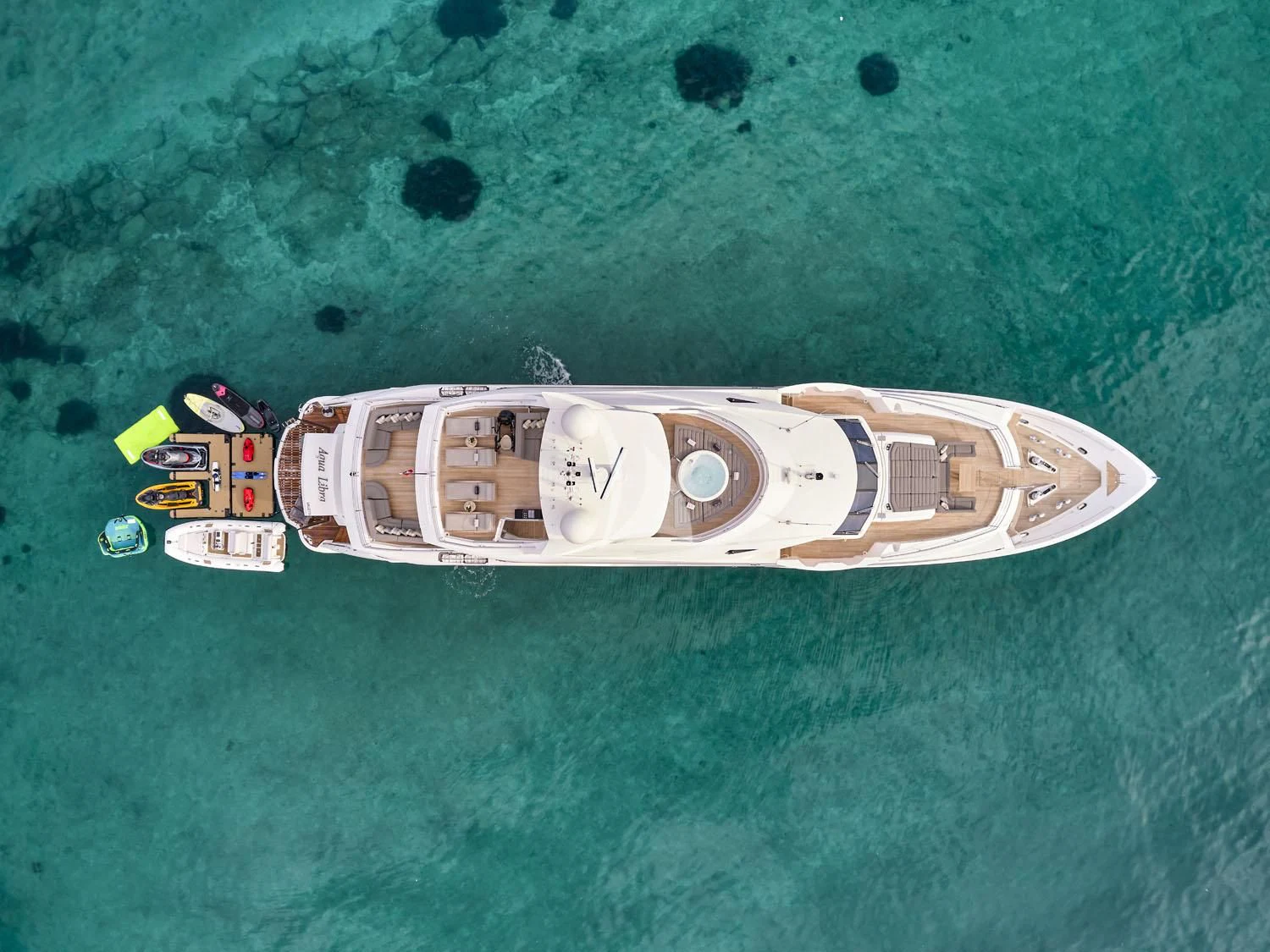 a toy ship on a body of water aboard AQUA LIBRA Yacht for Charter