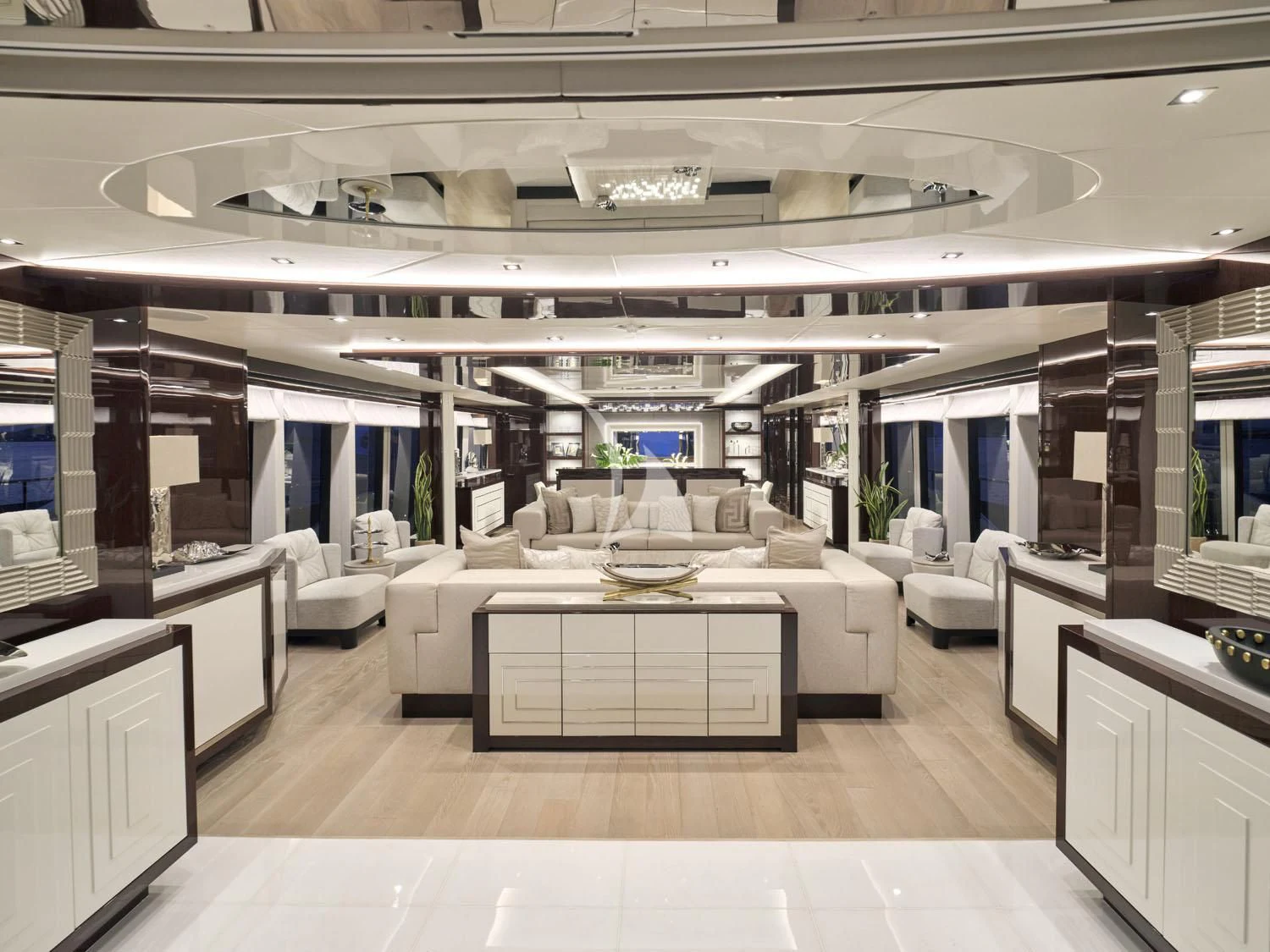 a large room with a table and chairs aboard AQUA LIBRA Yacht for Charter