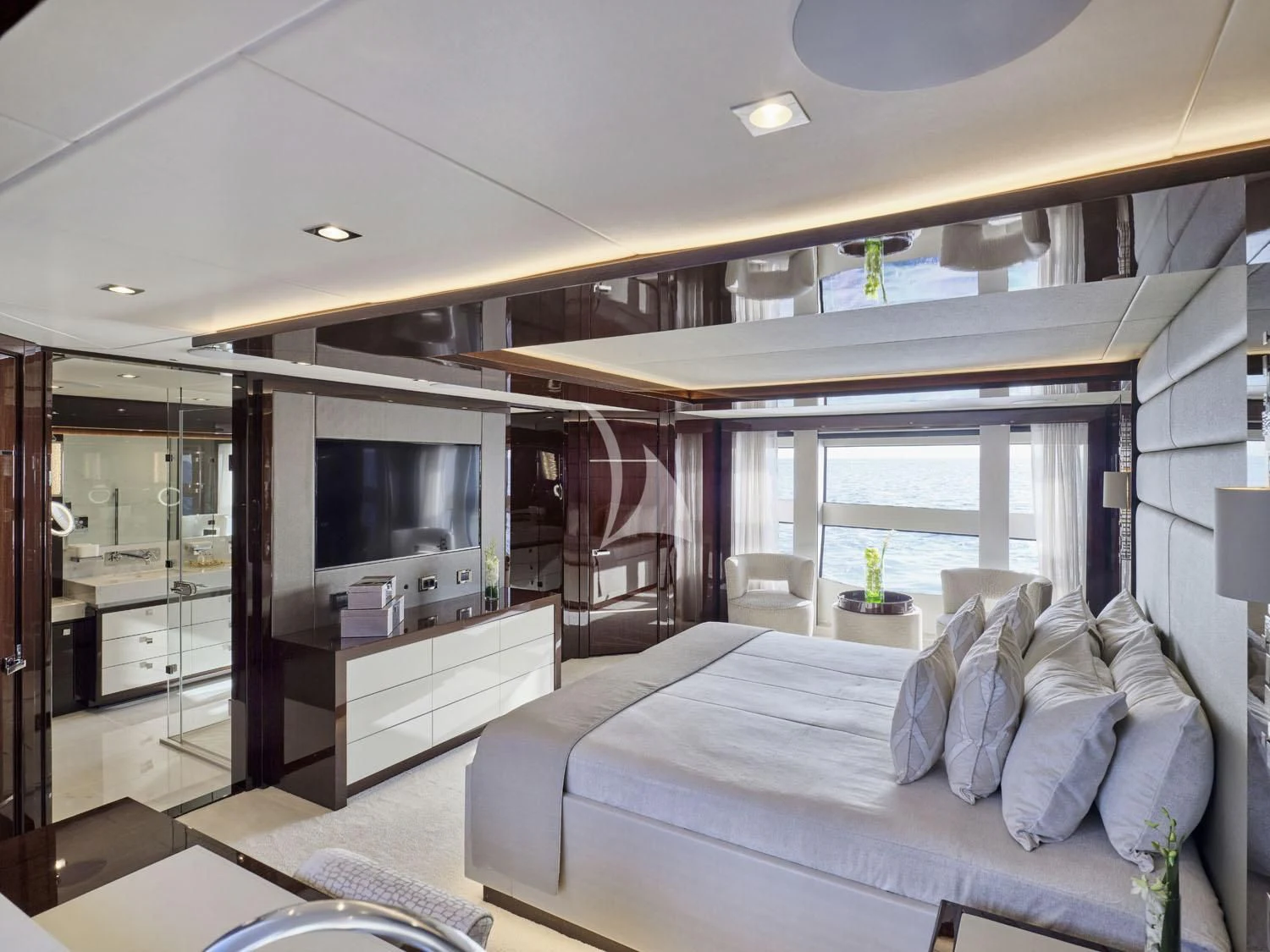 a bedroom with a large bed aboard AQUA LIBRA Yacht for Charter