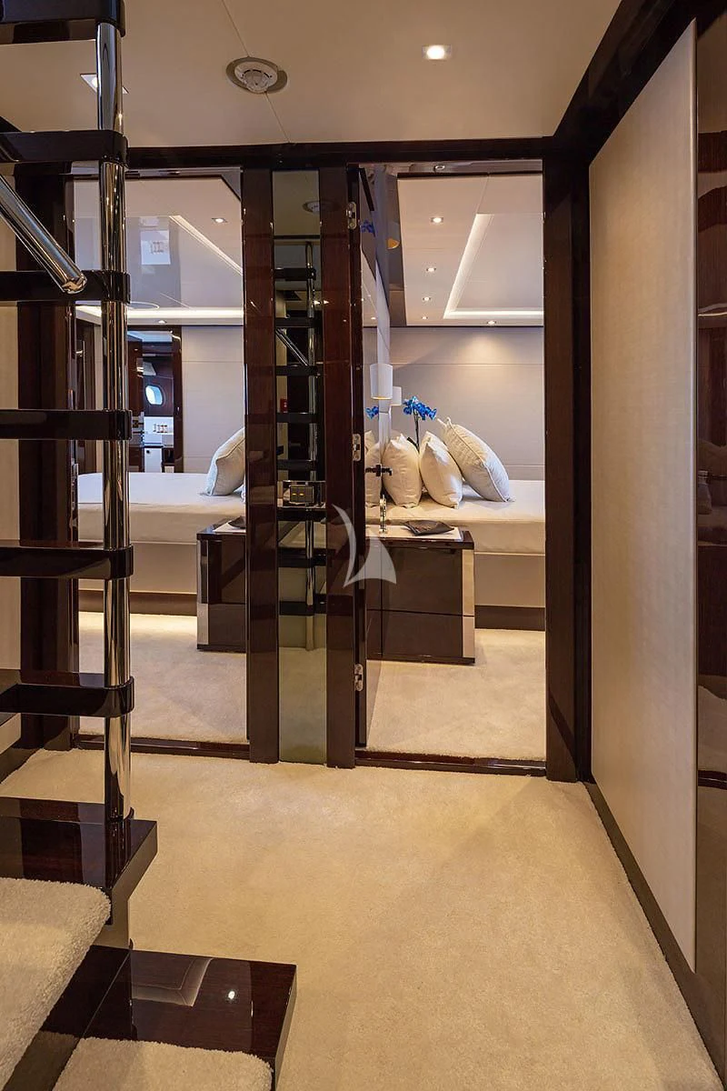 a room with a bed and a ladder aboard AQUA LIBRA Yacht for Charter