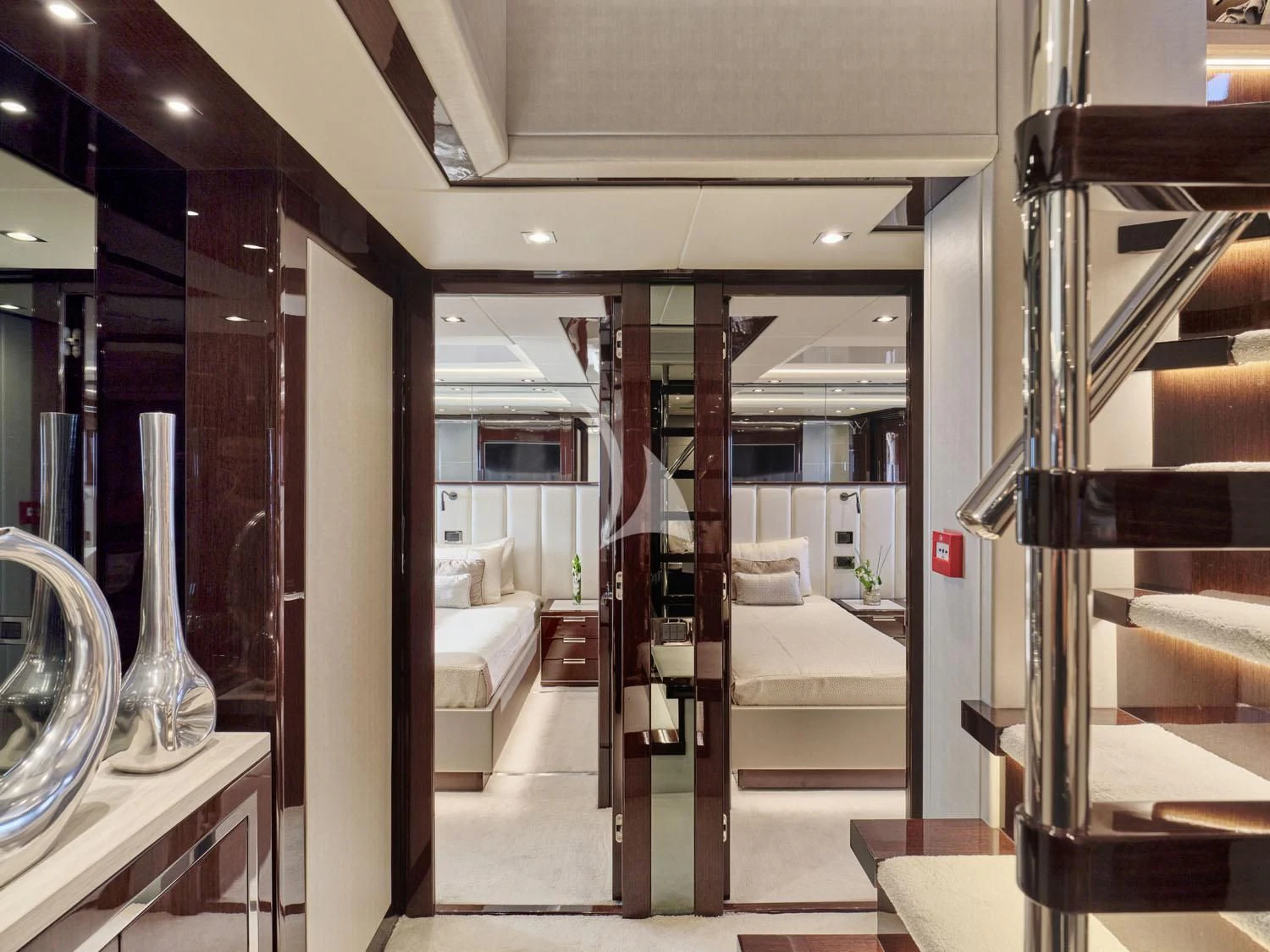 a room with a staircase and a glass case aboard AQUA LIBRA Yacht for Charter