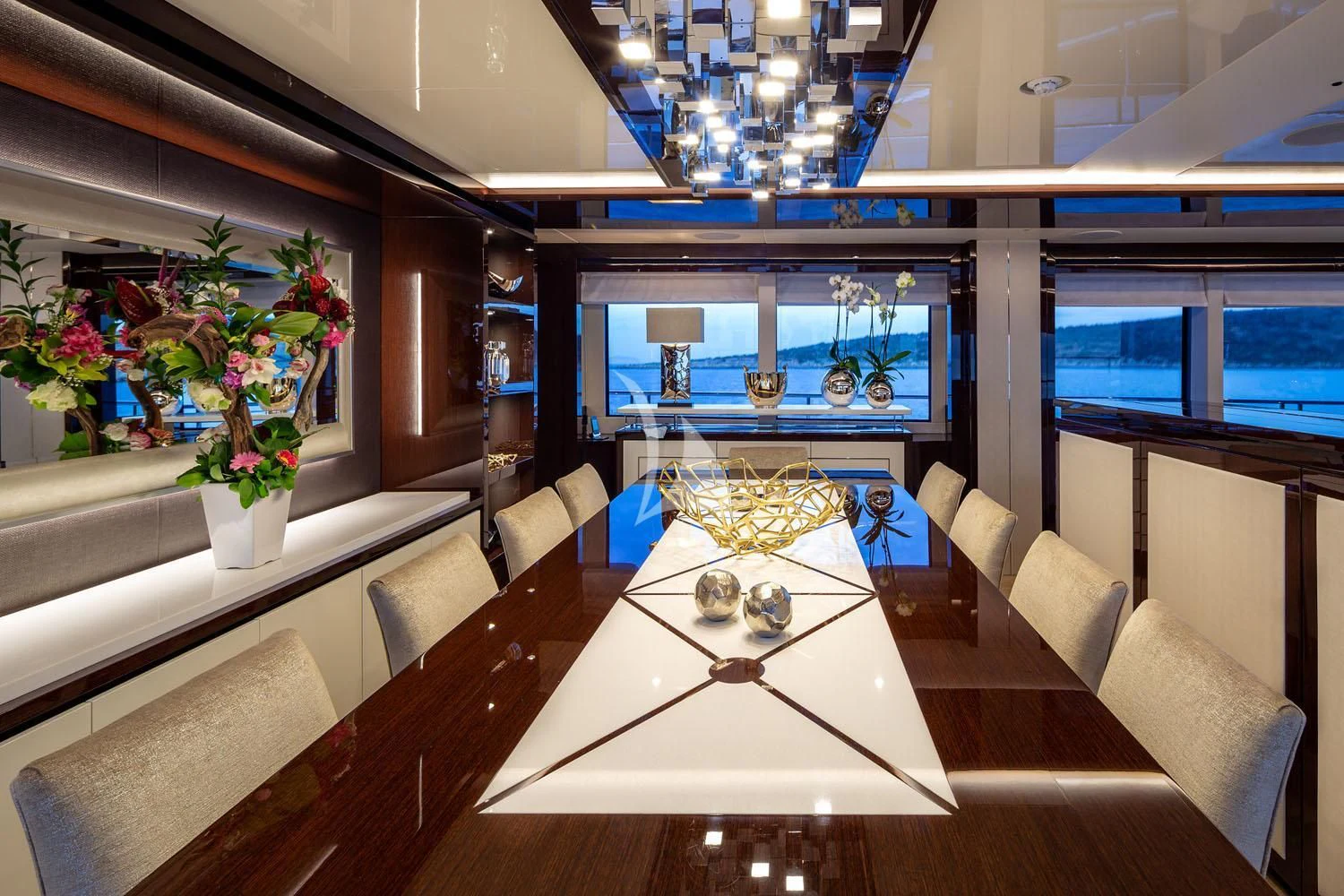 a room with a table and chairs aboard AQUA LIBRA Yacht for Charter