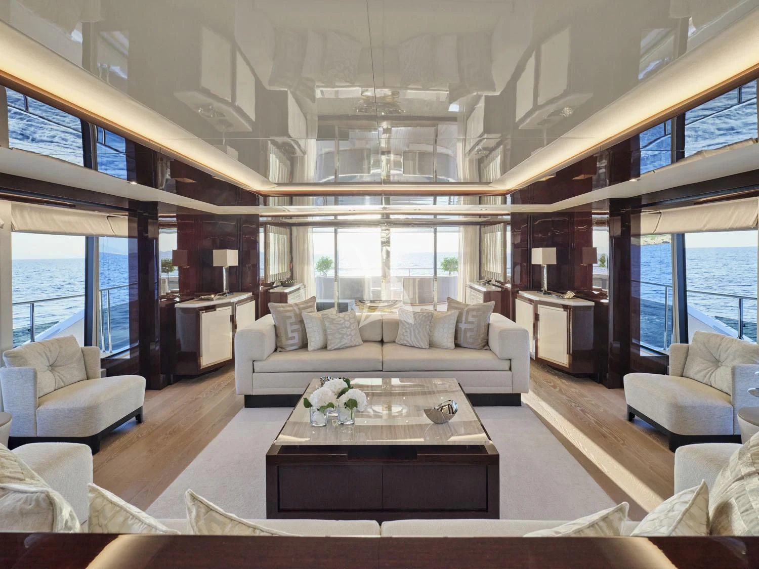 a living room with a large window aboard AQUA LIBRA Yacht for Charter
