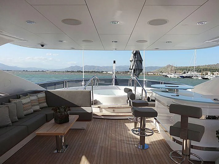 a room with a couch and a pool aboard AQUA LIBRA Yacht for Charter