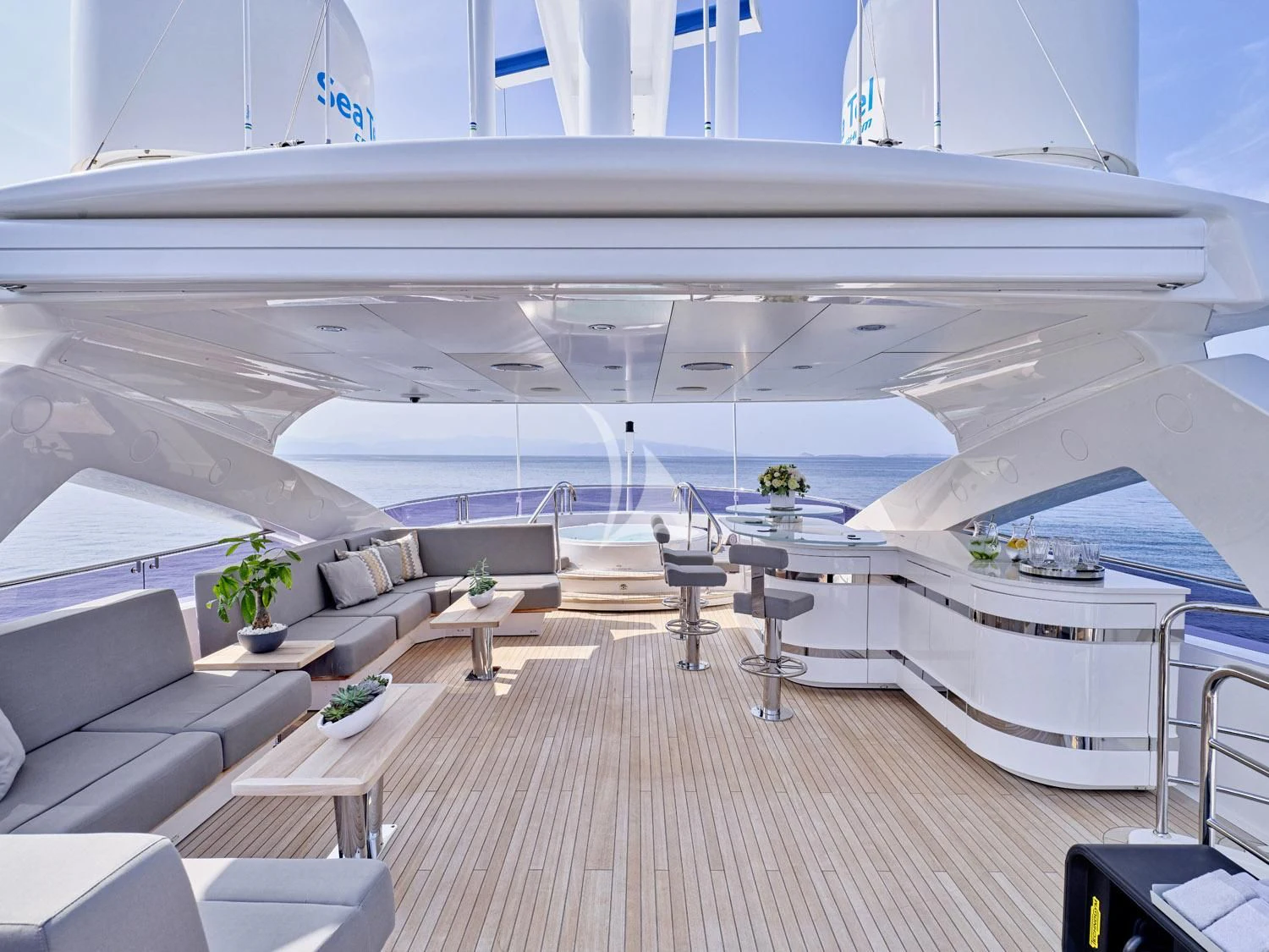 a large white room with a wood floor and a large white ceiling aboard AQUA LIBRA Yacht for Charter