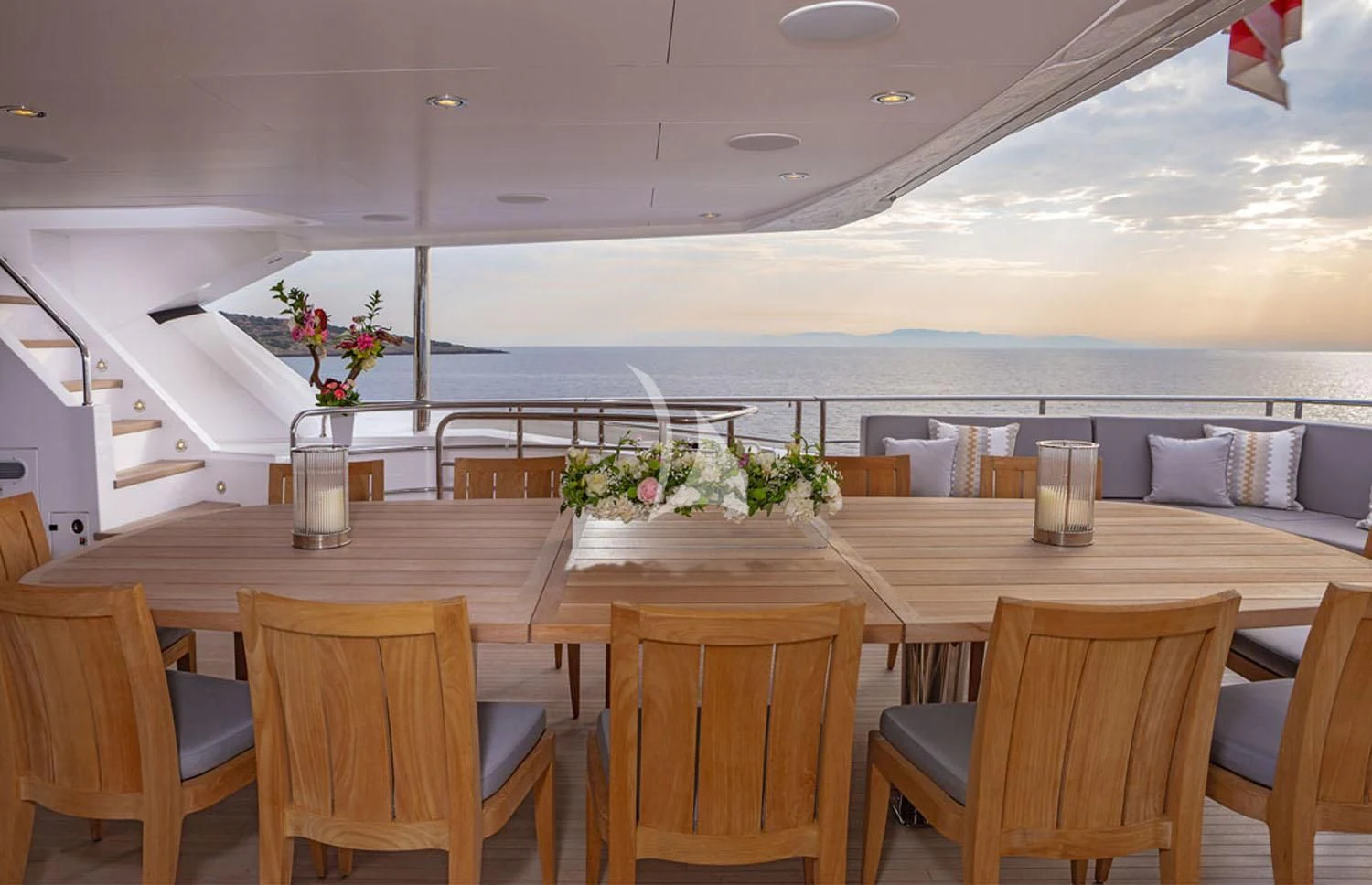 a room with a table and chairs aboard AQUA LIBRA Yacht for Charter