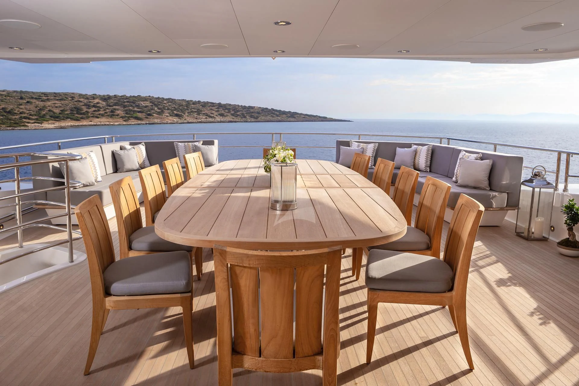 a table and chairs on a deck aboard AQUA LIBRA Yacht for Charter