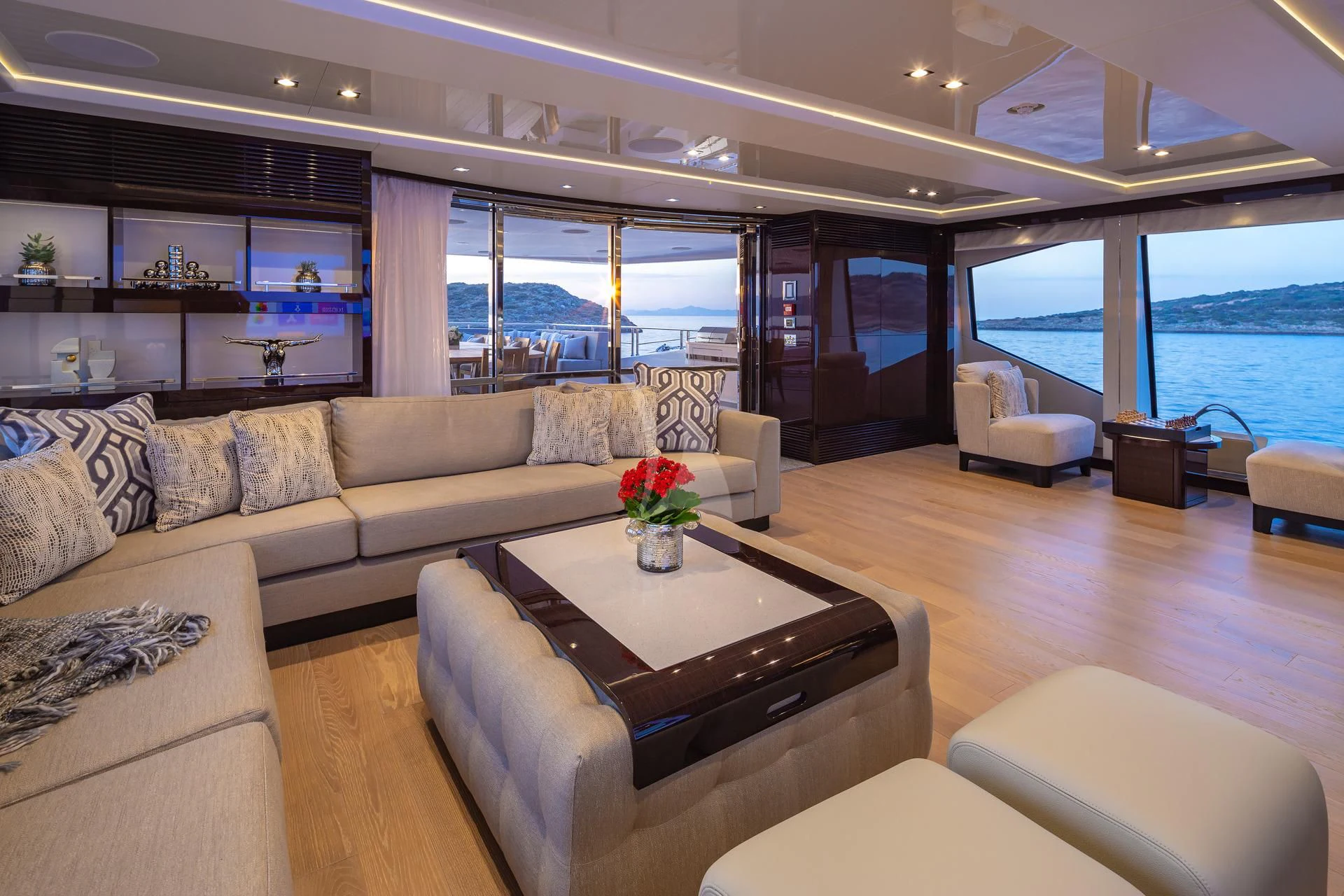 a living room with a large window aboard AQUA LIBRA Yacht for Charter