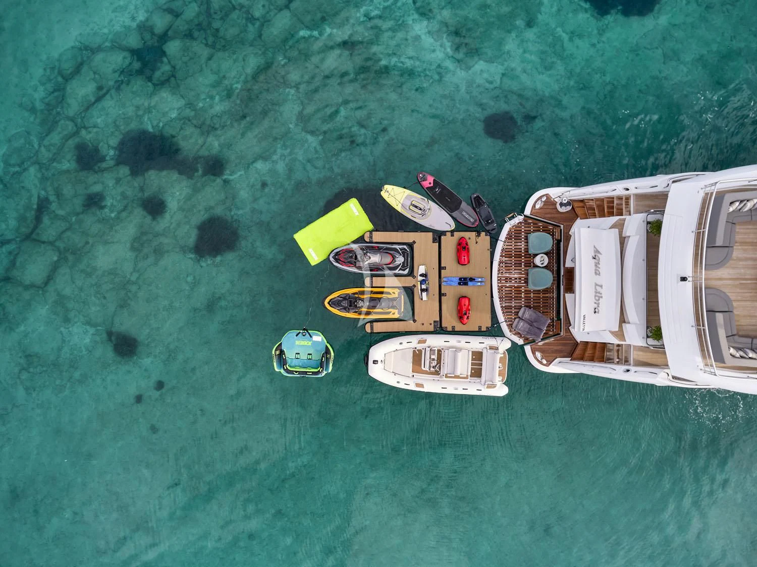 a group of boats in the water aboard AQUA LIBRA Yacht for Charter