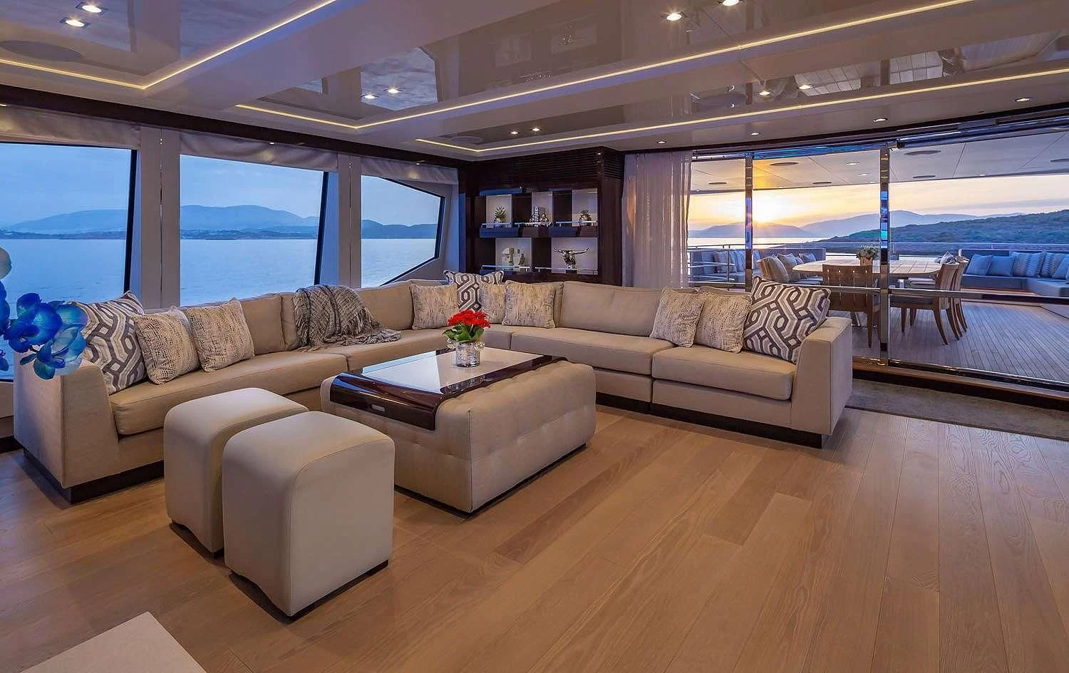 a living room with a couch and a coffee table aboard AQUA LIBRA Yacht for Charter