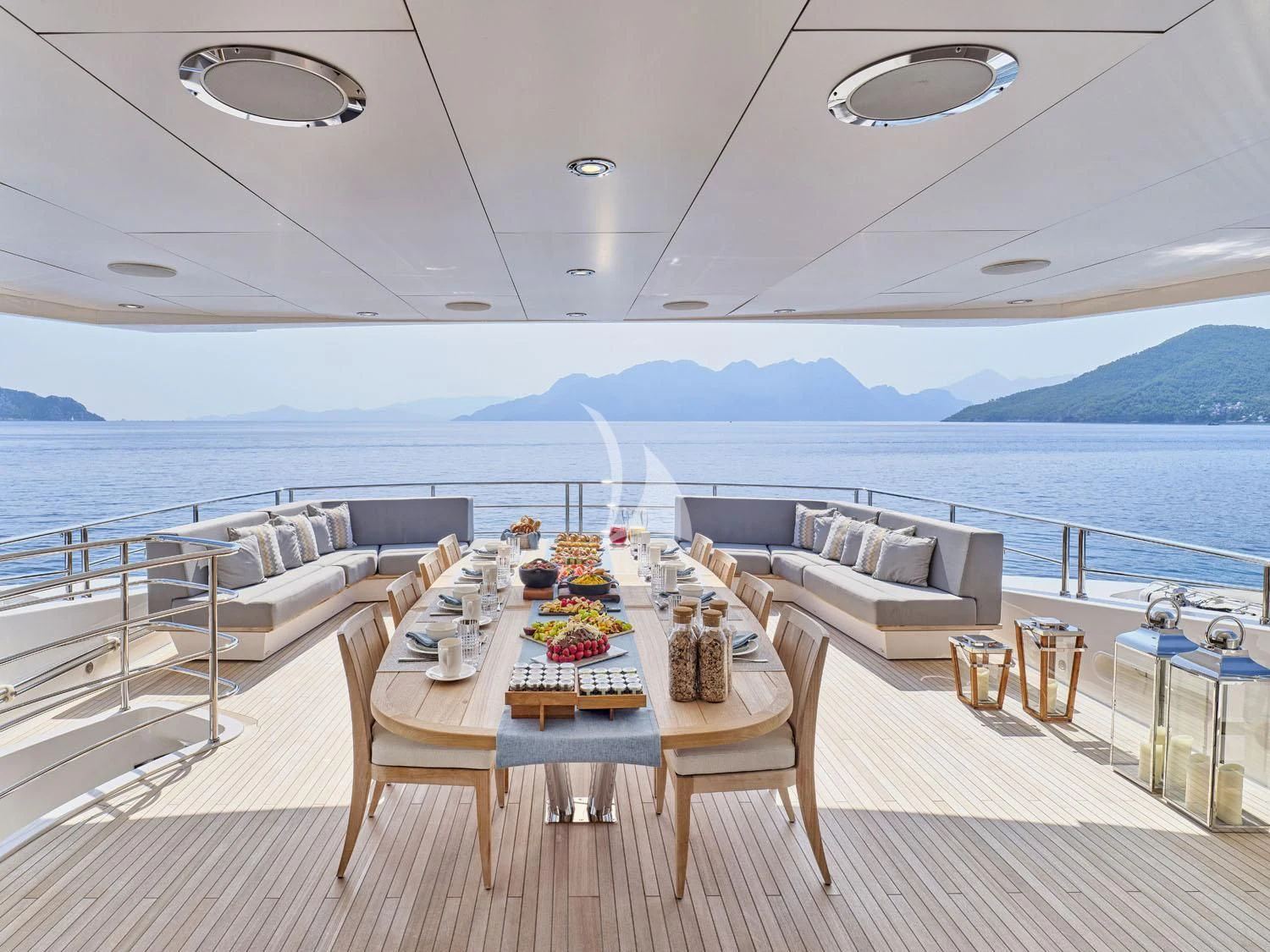 a room with a table and chairs aboard AQUA LIBRA Yacht for Charter