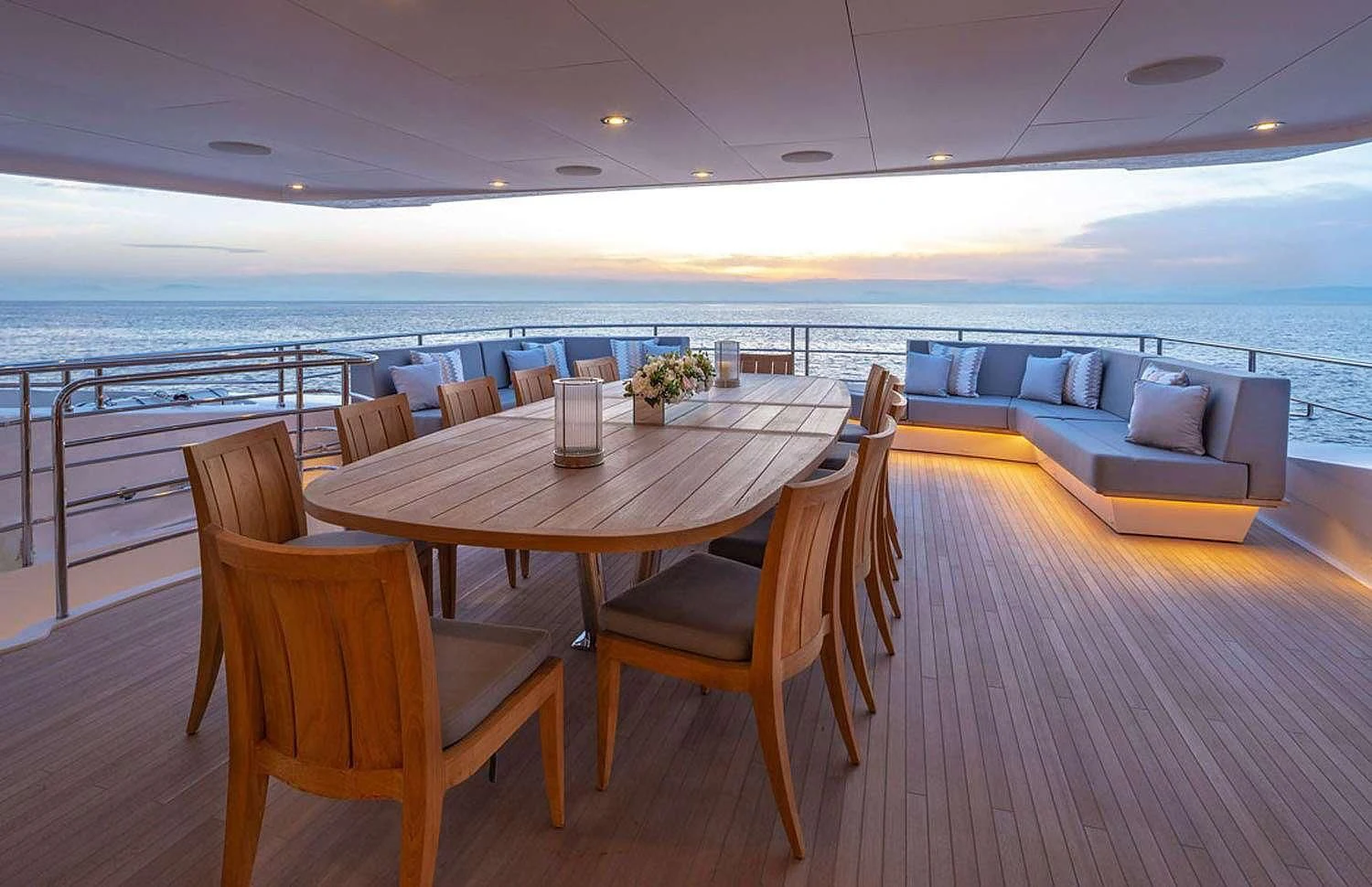 a table and chairs on a deck aboard AQUA LIBRA Yacht for Charter