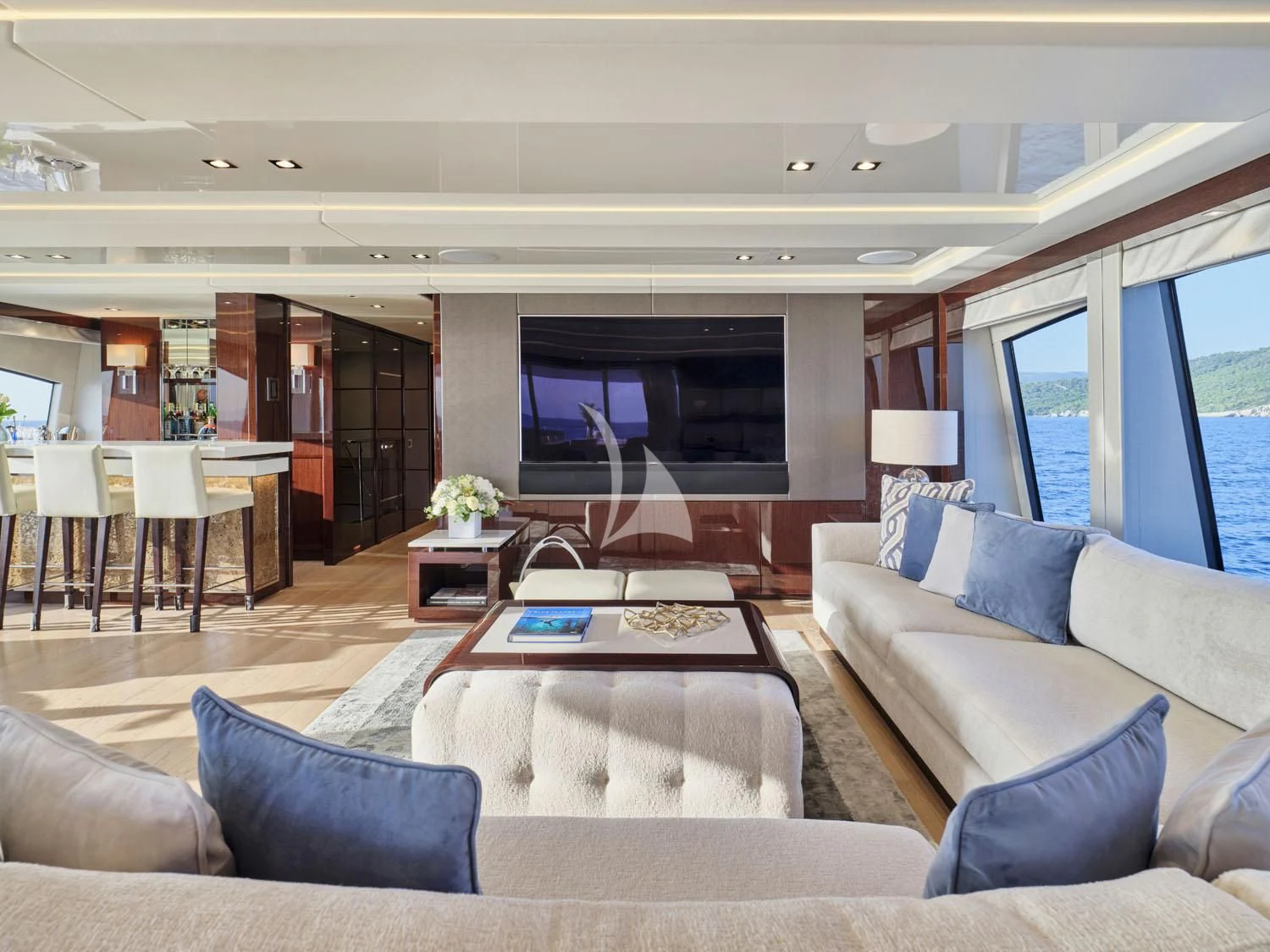 a living room with a large screen aboard AQUA LIBRA Yacht for Charter