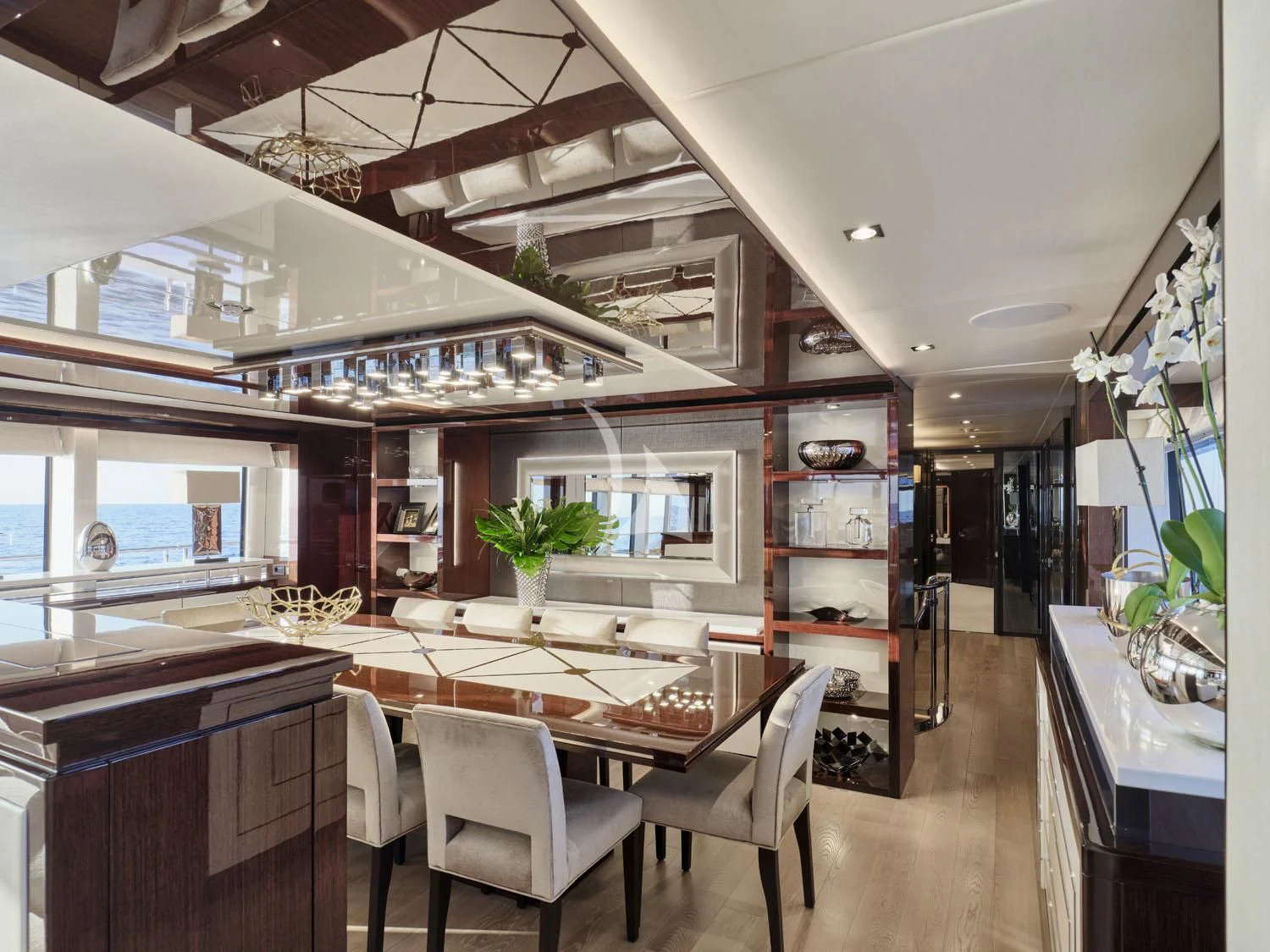 a kitchen with a table and chairs aboard AQUA LIBRA Yacht for Charter