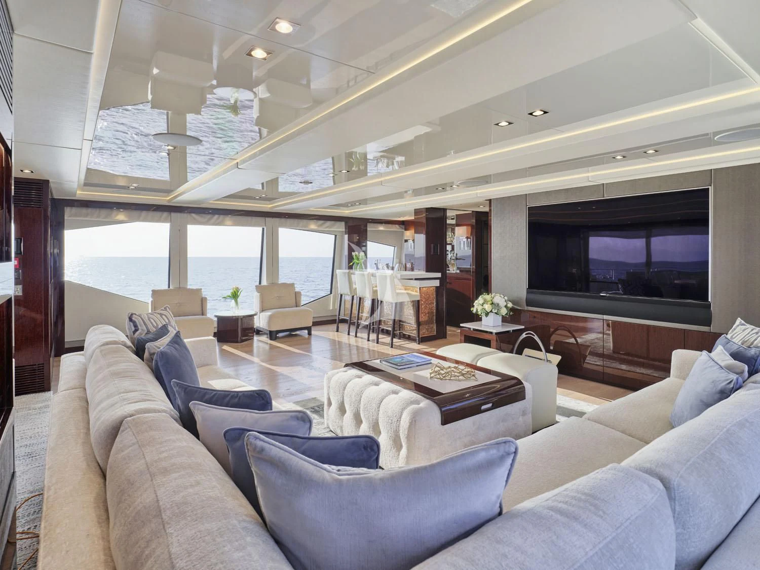 a living room with a large window aboard AQUA LIBRA Yacht for Charter