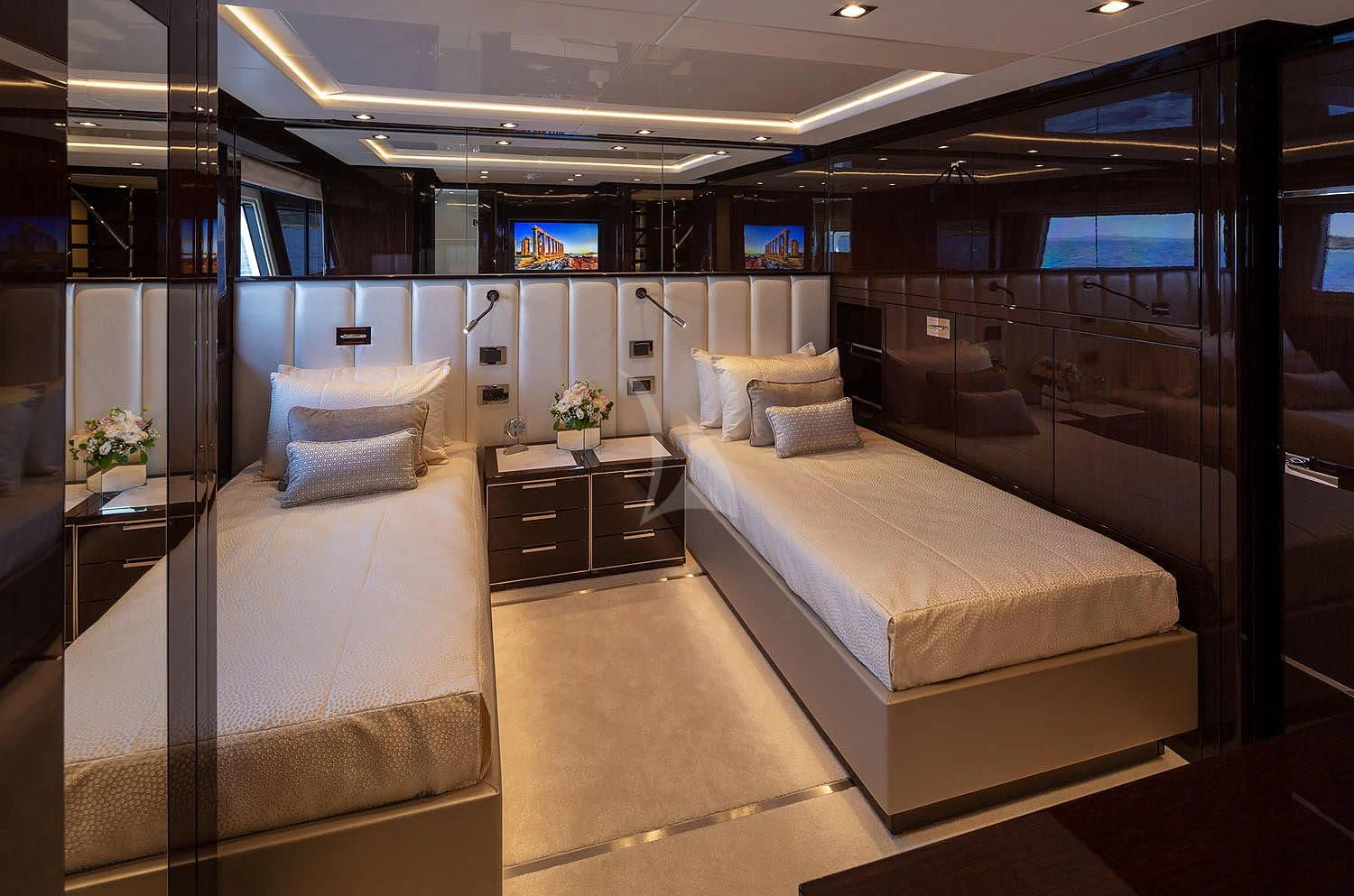 a room with a bed and a desk aboard AQUA LIBRA Yacht for Charter