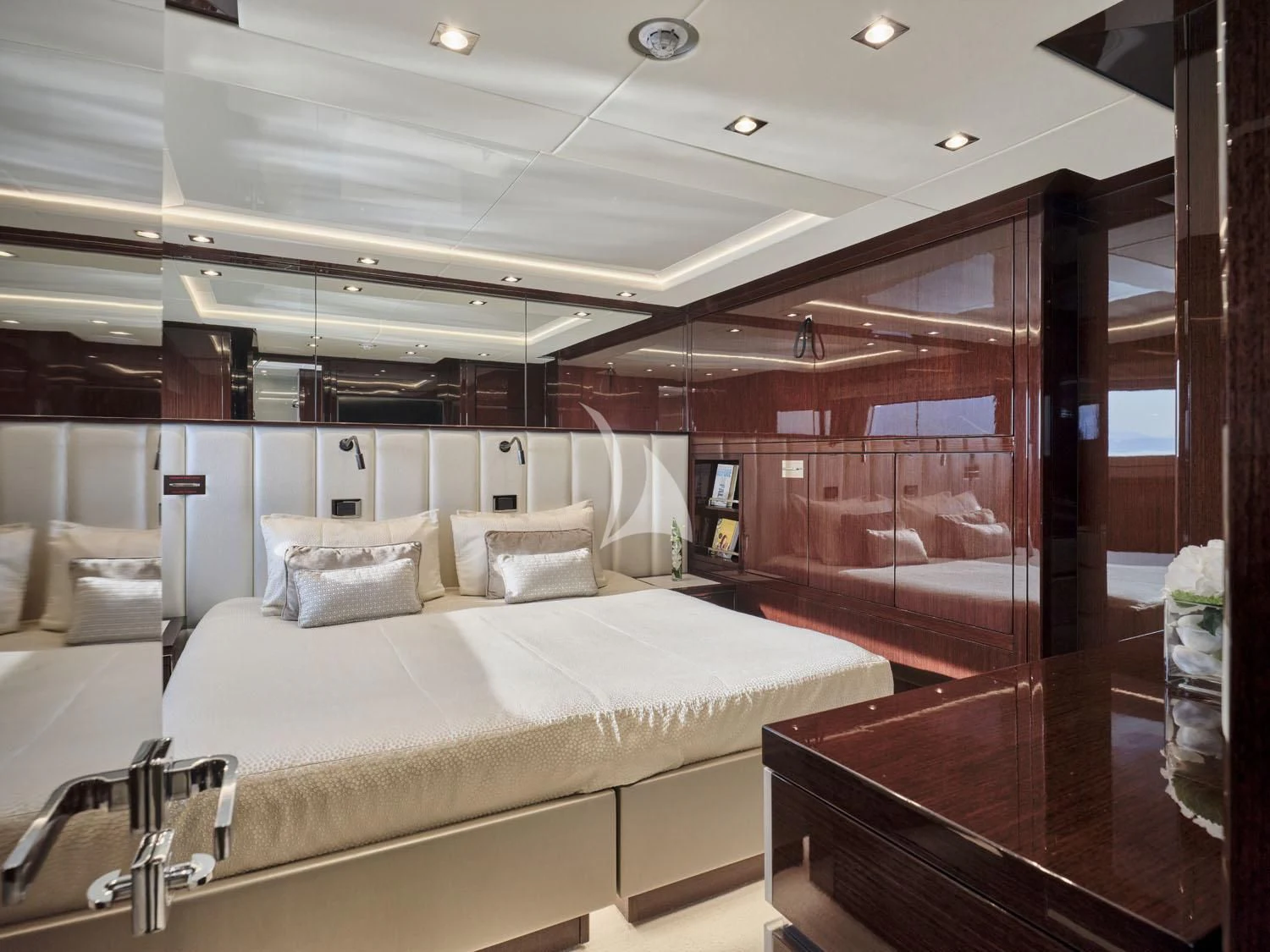 a room with a bed and a desk aboard AQUA LIBRA Yacht for Charter
