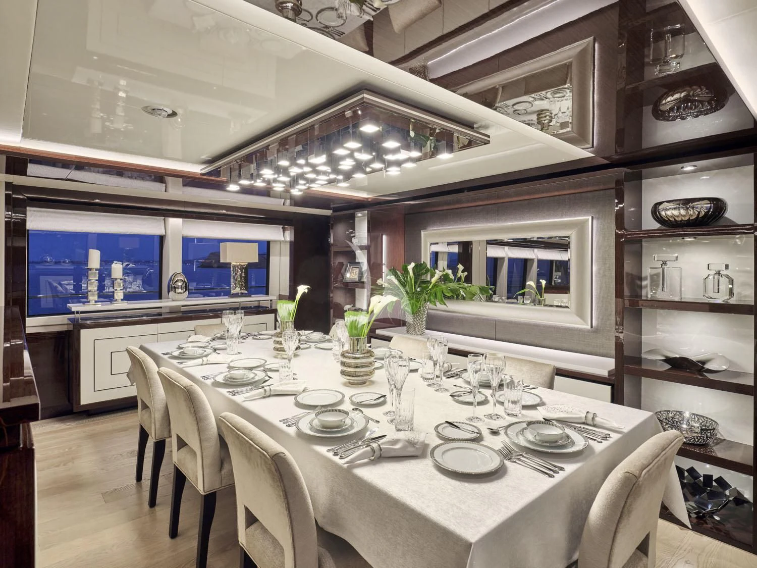 a dining room with a table set aboard AQUA LIBRA Yacht for Charter