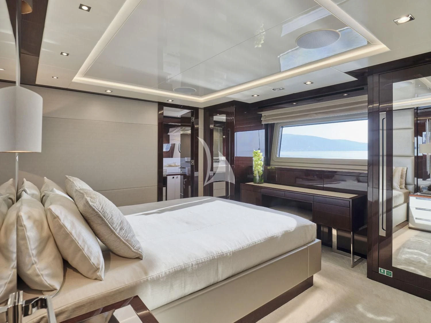 a bedroom with a large bed aboard AQUA LIBRA Yacht for Charter