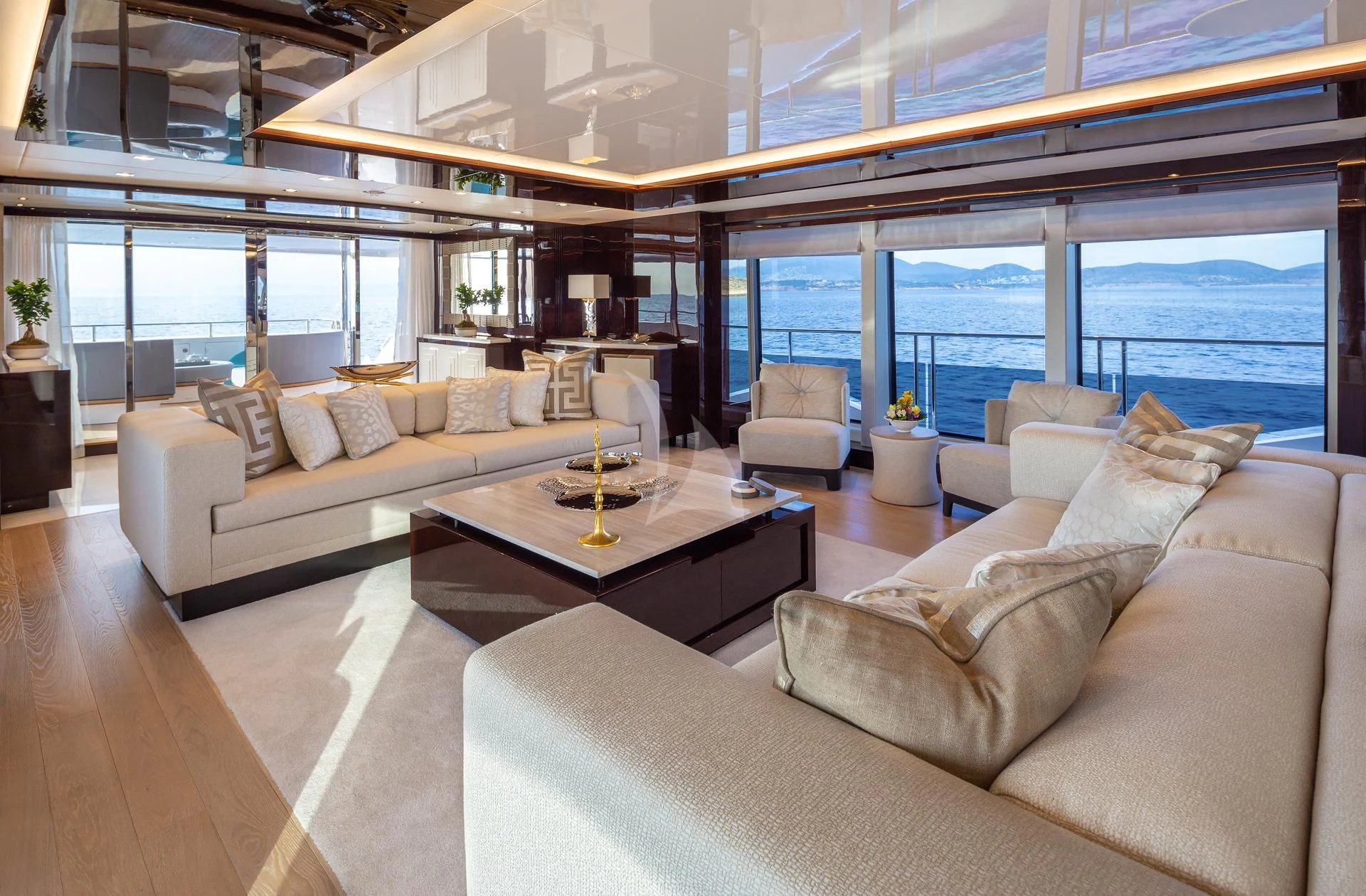 a living room with a large window aboard AQUA LIBRA Yacht for Charter