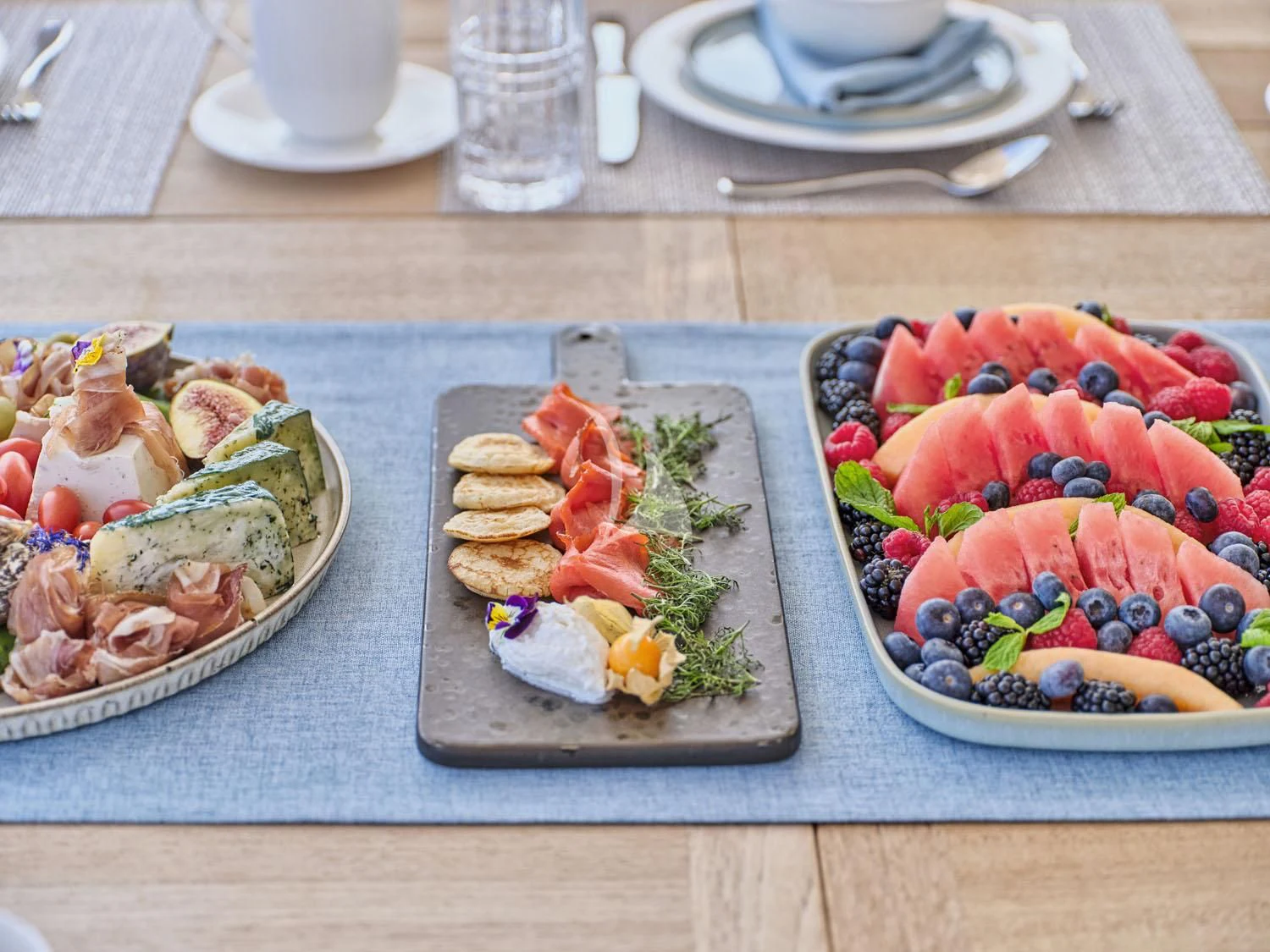 a table with plates of food aboard AQUA LIBRA Yacht for Charter