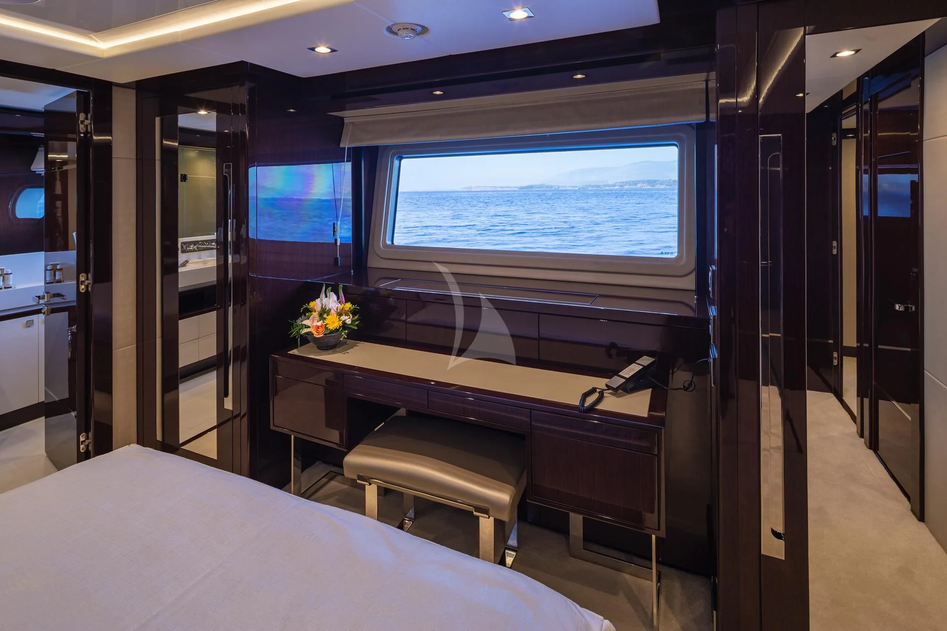 a room with a desk and a bed aboard AQUA LIBRA Yacht for Charter